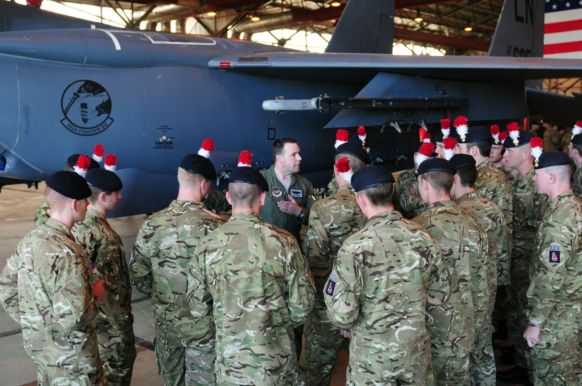 ROYAL AIR FORCE LAKENHEATH, England – Capt. Erik Brown, 494th Fighter Squadron pilot, talks about the F-15E Strike Eagle capabilities to members of the British Army 2nd Battalion Royal Regiment of Fusiliers, C Company, May 25, 2012. The soldiers visited RAF Lakenheath for a chance to become familiar with the wing’s aircraft and aircrew.  (U.S. Air Force photo by Airman 1st Class Cory D. Payne)
