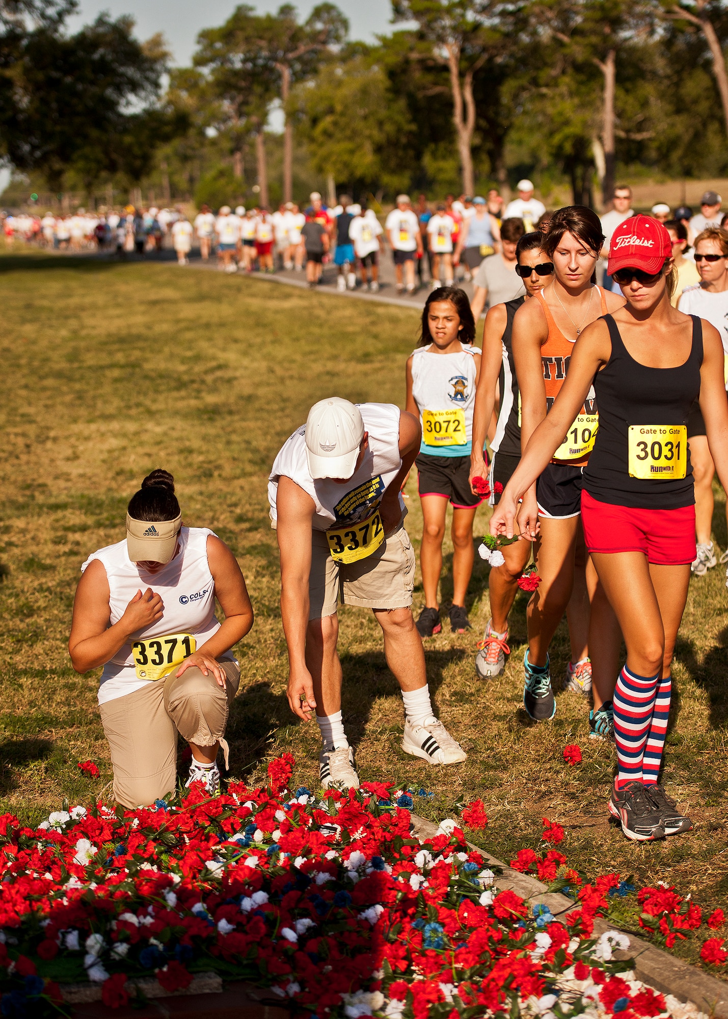 Runners pay their respects as they pass by the All Wars Memorial during the Gate-to-Gate run May 28 at Eglin Air Force Base, Fla.  More than 1,600 people ran in the annual Memorial Day event.  (U.S. Air Force photo/Samuel King Jr.)