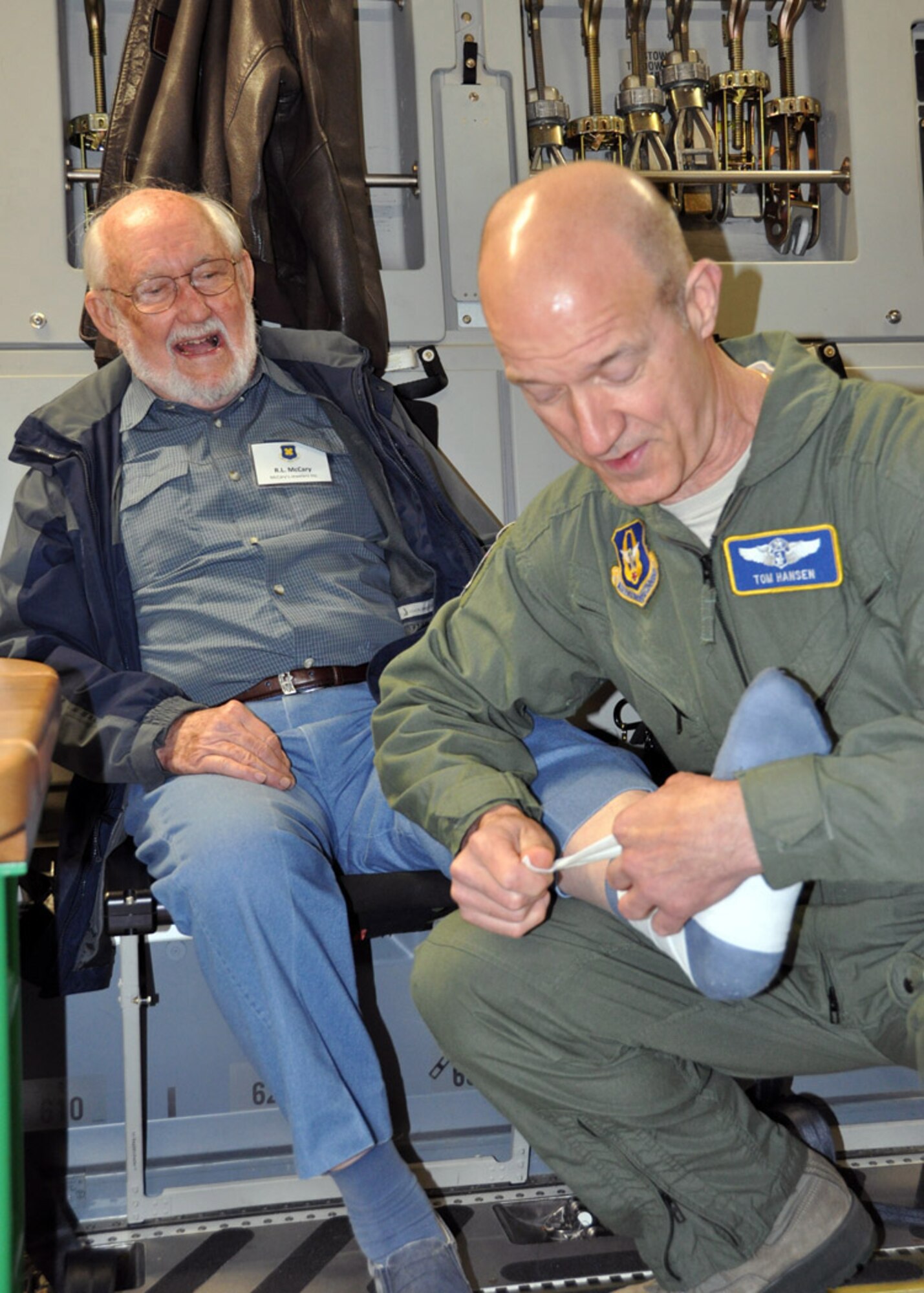 Civic leader Ray McCary has his ankle bandaged by Lt. Col. Tom Hanson, a flight nurse evaluator with the 446th Aeromedical Evacuation Squadron, during the 307th Bomb Wing/917th Fighter Group Civic Leader Tour to Joint Base Lewis-McChord in Tacoma, Wash., May 23-24, 2012.  Aeromedical evacuation off-load, explosive ordnance disposal demonstration, training simulations, and a C-17 airdrop were all part of the two-day tour. (U.S. Air Force photo/Master Sgt. Mary Hinson)