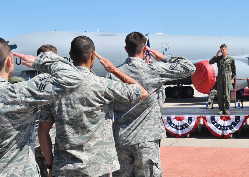 Airmen from the 22nd Operations Support Squadron render their final salute to Lt. Col. Paul Scott, outgoing 22nd OSS commander, during a change of command ceremony May 21, 2012, McConnell Air Force Base Kan.  The ceremony is a tradition in which authority and responsibility for a unit is transferred from one commanding officer to another. (U.S. Air Force photo/Airman 1st Class Maurice A. Hodges)