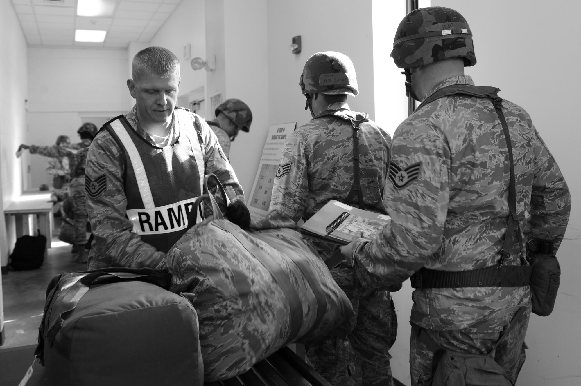 Airmen go through a personnel deployment facility on Seymour Johnson Air Force Base, N.C. March 5, 2012. Unit deployment managers must ensure depoying Airmen have everything they need before sending them through the PDF. The PDF is the last chance to make sure Airmen are fully ready to deploy.  (U.S. Air Force photo/Airman 1st Class John Nieves Camacho/Released)