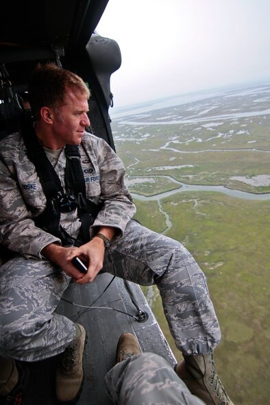 U.S. Air Force Capt. Daniel Roske surveys the New Jersey coastline from a New Jersey Army National Guard Black Hawk helicopter from the 1-150th Assault Helicopter Battalion on May 23 during an Employer Support of the Guard and Reserve event.  Roske, an Air Liaison Officer assigned to the 227th Air Support Operations Squadron, is a New Jersey Air National Guardsman, as well as an Ocean County Prosecuter's Office Detective.   U.S. Air Force photo/Tech. Sgt. Matt Hecht 