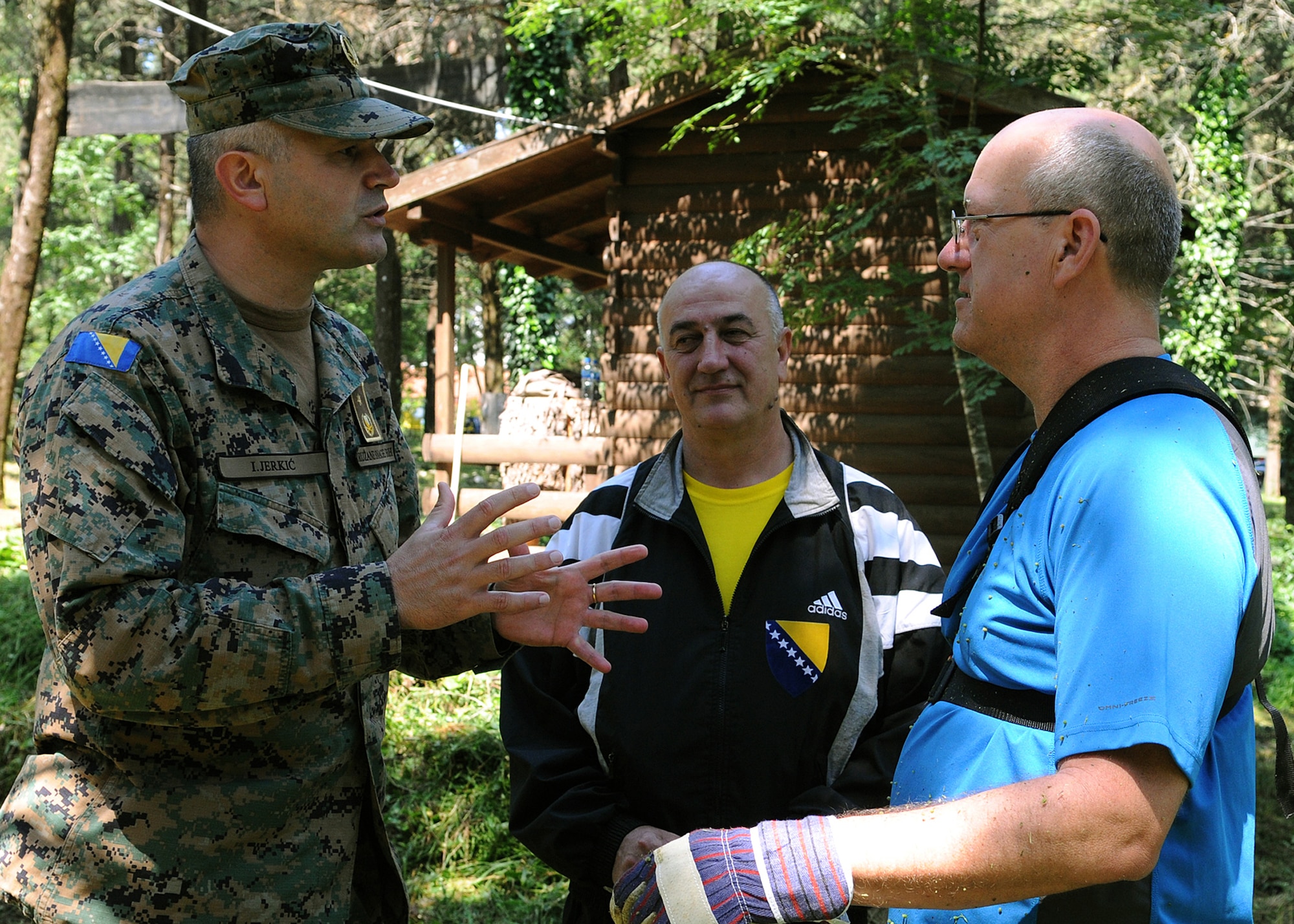 Bosnian-Herzegovinian army Brig. Gen. Ivica Jerkic, Shared Resilience 2012 co-director, greets U.S. Air Force Col. Robert Marks (right), SR12 co-director, at the Hutovo Blato National Forest here May 27, 2012. More than 150 Bosnian-Herzegovinian military and firefighters and U.S. service members worked together at the national forest to clean up damage caused by a fire in 2011. The goal of the event was to build camaraderie between the partnered nations before beginning Shared Resilience 2012, an annual U.S. Joint Chiefs of Staff-sponsored exercise May 28 - June 8.