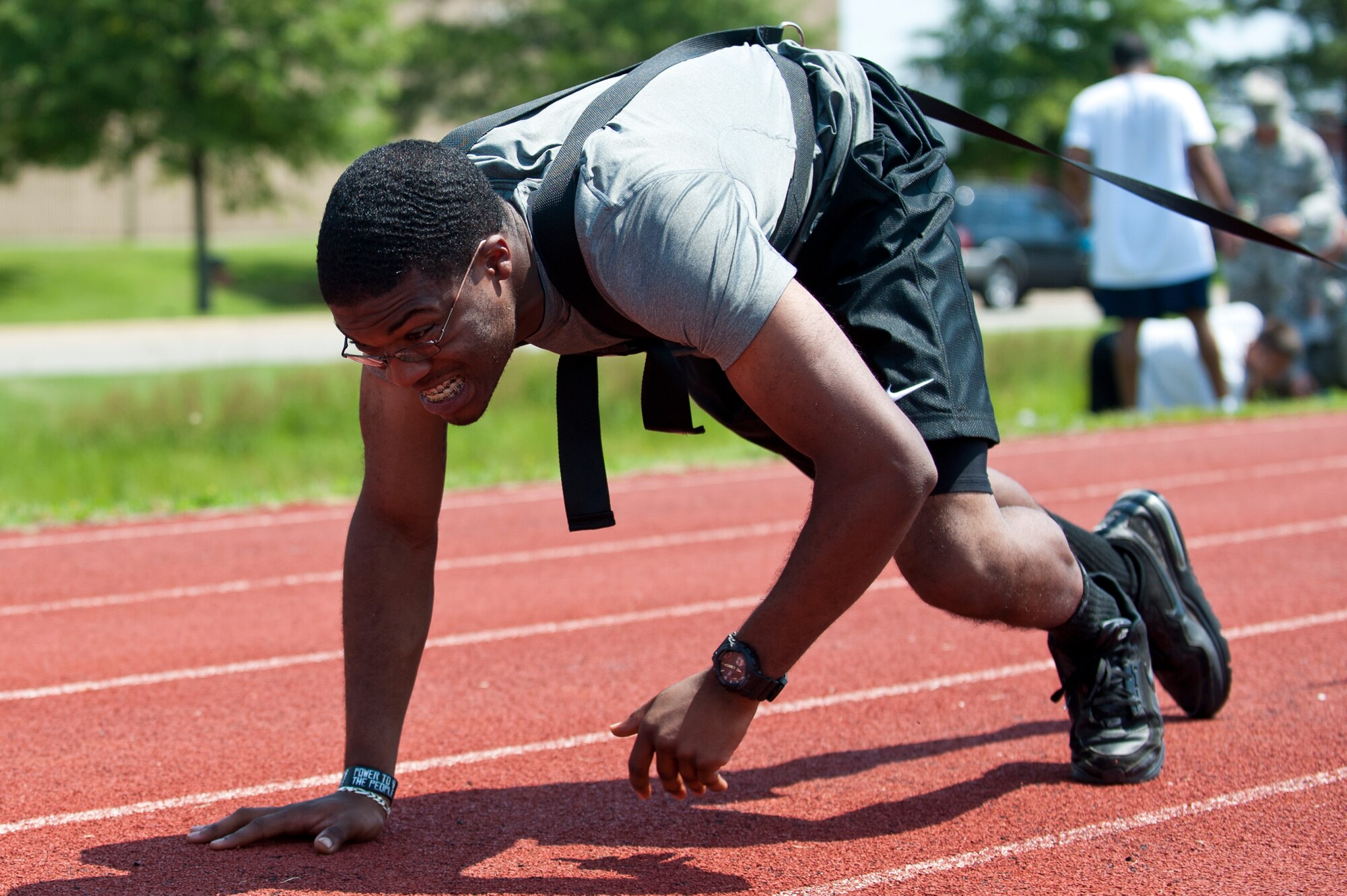 U.S. Air Force Airman 1st Class Stefaugn Waters, 633rd Force Support Squadron career development technician, performs a weighted, bear-crawl exercise during the annual Squadron Fitness Challenge at Langley Air Force Base, Va., May 24, 2012.  The Squadron Fitness Challenge takes place during May Fitness Month, which promotes living a healthier lifestyle.  (U.S. Air Force photo by Airman 1st Class Kayla Newman/Released)