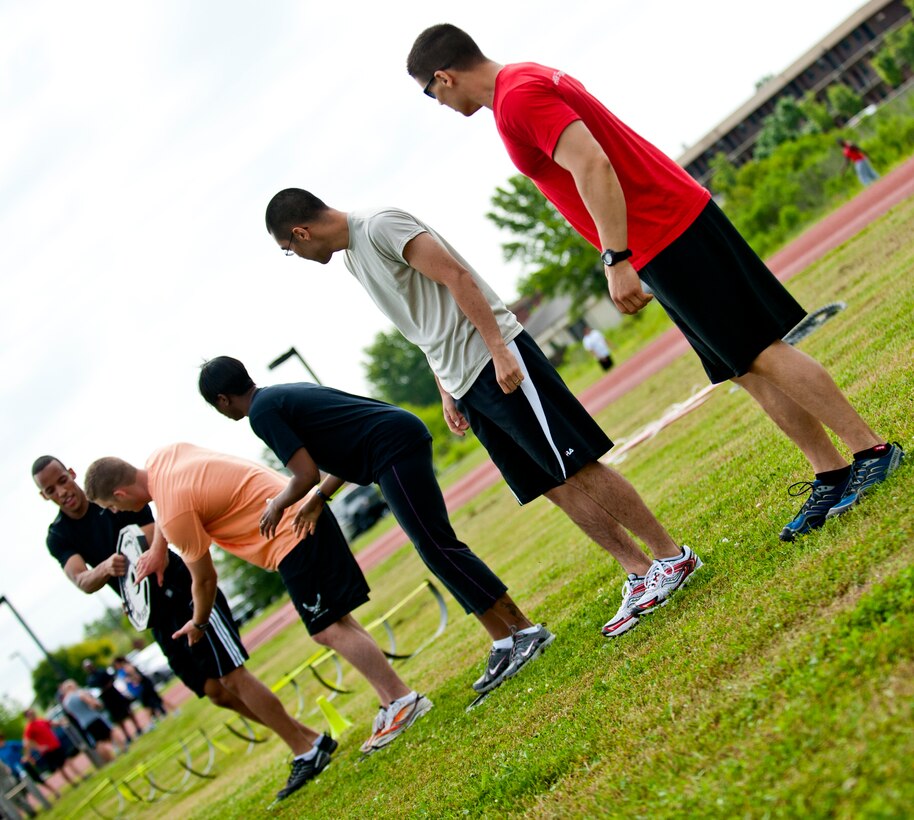 U.S. Air Force Airmen from the 633rd Contracting Squadron participate in the annual Squadron Fitness Challenge at Langley Air Force Base, Va., May 24, 2012.  The Squadron Fitness Challenge takes place during May Fitness Month, which promotes living a healthier lifestyle.  (U.S. Air Force photo by Airman 1st Class Kayla Newman/Released)