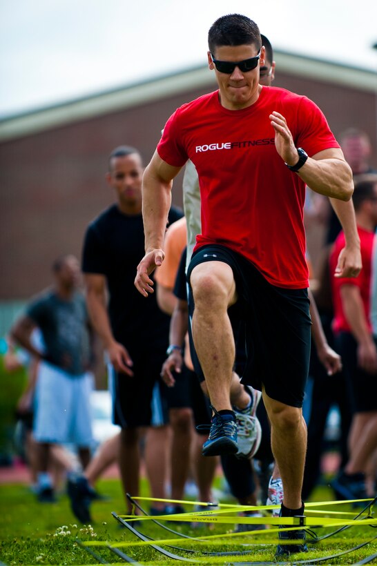 U.S. Air Force 1st Lt. Dave Earl, 633rd Contracting Squadron contracting specialist, participates in an event at the annual Squadron Fitness Challenge at Langley Air Force Base, Va., May 24, 2012.  The Squadron Fitness Challenge consisted of seven events designed to test physical strength and build camaraderie among units.  (U.S. Air Force photo by Airman 1st Class Kayla Newman/Released)