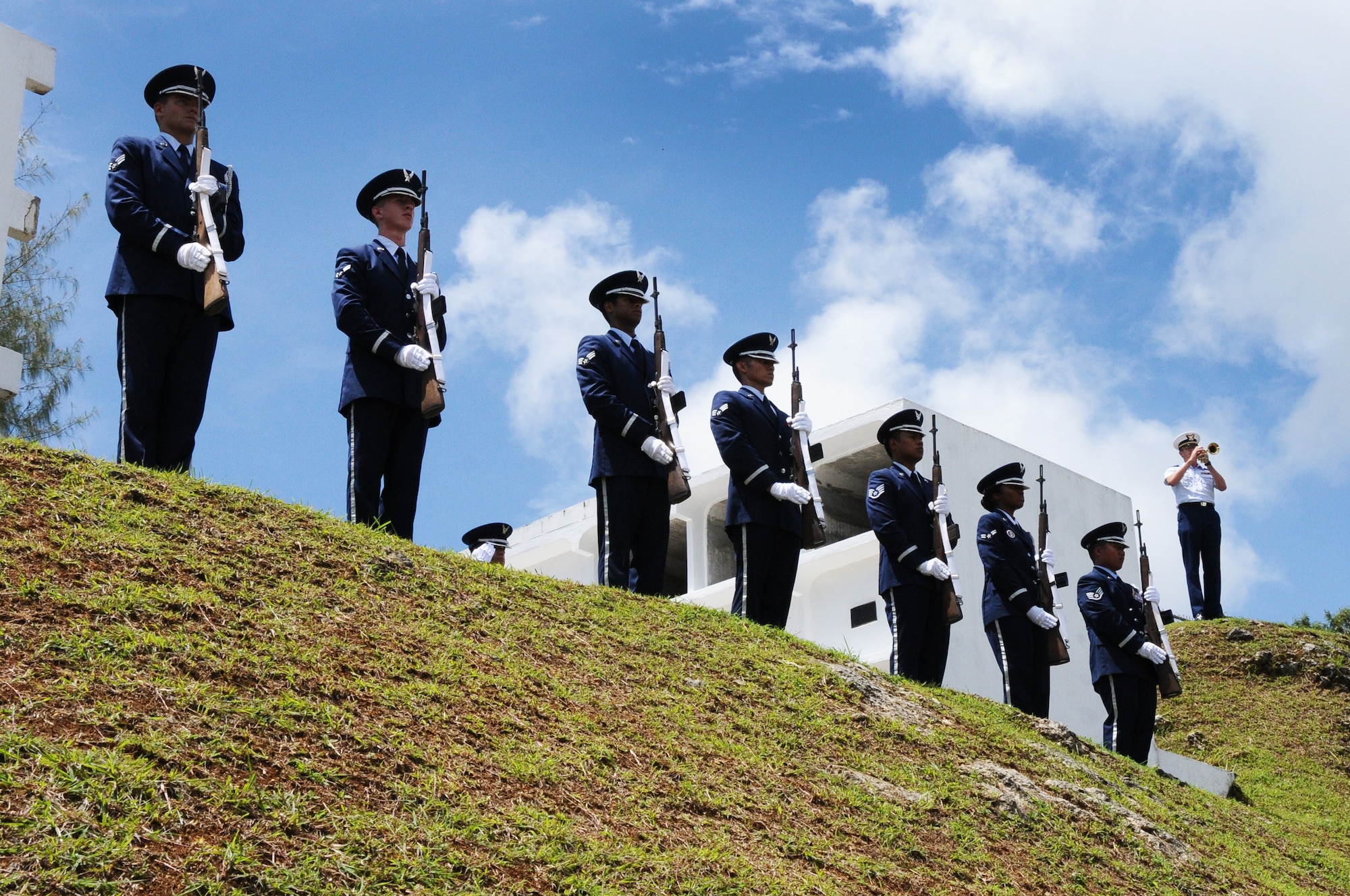 ANDERSEN AIR FORCE BASE, Guam- The Andersen Air Force Base Honor Guard, known as the “Blue Knights,” present arms after the 21-gun salute during the Guam Veteran Cemetery Memorial May 28. Multiple military and government organizations came together to support the ceremony and honor those who have paid the ultimate price for freedom. (U.S. Air Force photo by Senior Airman Carlin Leslie/Released)