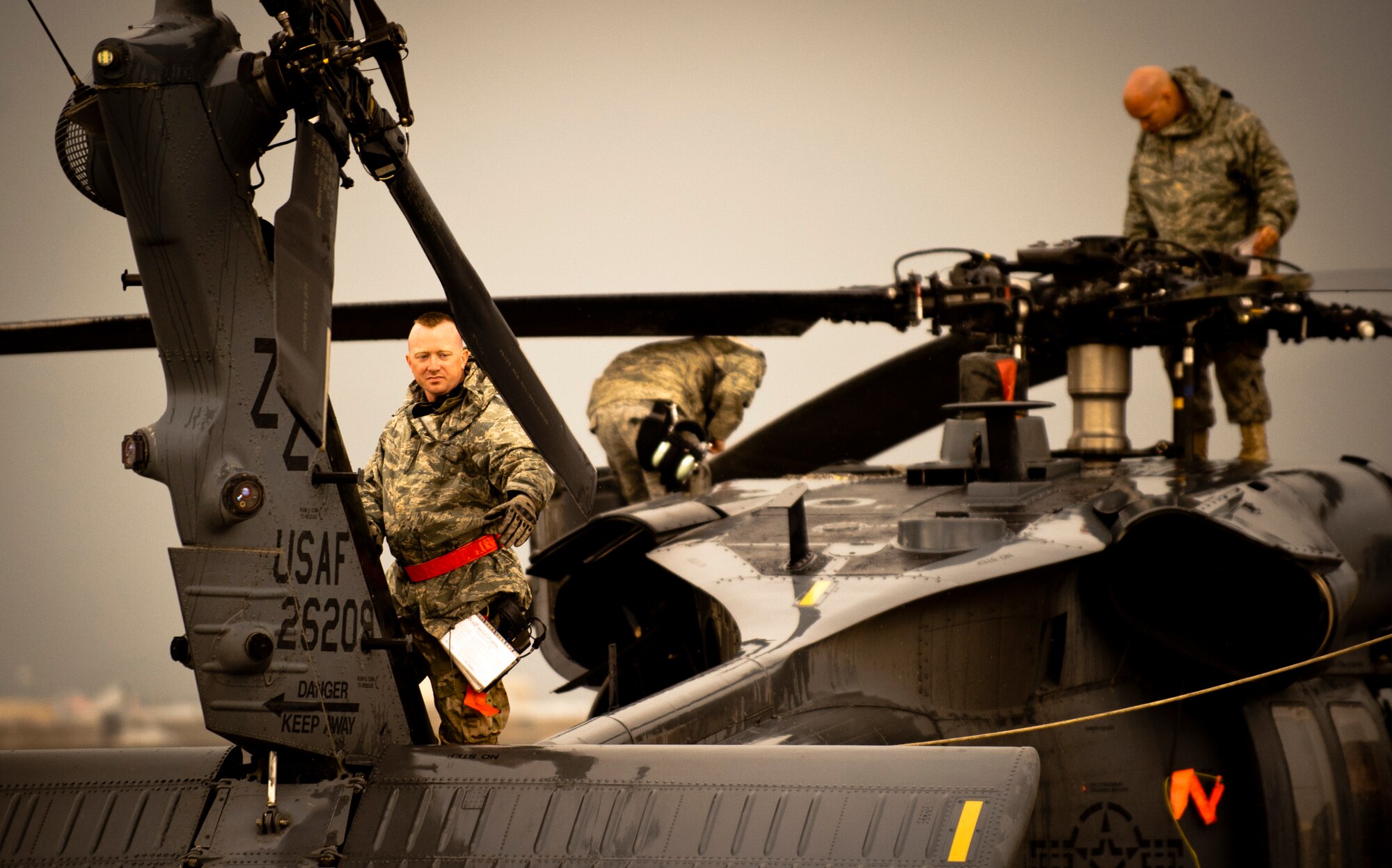 Maintainers from the 33rd Expeditionary Helicopter Maintenance Unit perform routine maintenance on a U.S. Air Force HH-60G Pave Hawk helicopter at Bagram Airfield, Afghanistan, May 25, 2012. The high operational tempo and austere environment of Afghanistan presents a unique challenge for the maintainers, who work around the clock to keep the Pave Hawks ready to fly.  (U.S. Air Force photo/Capt. Raymond Geoffroy)
