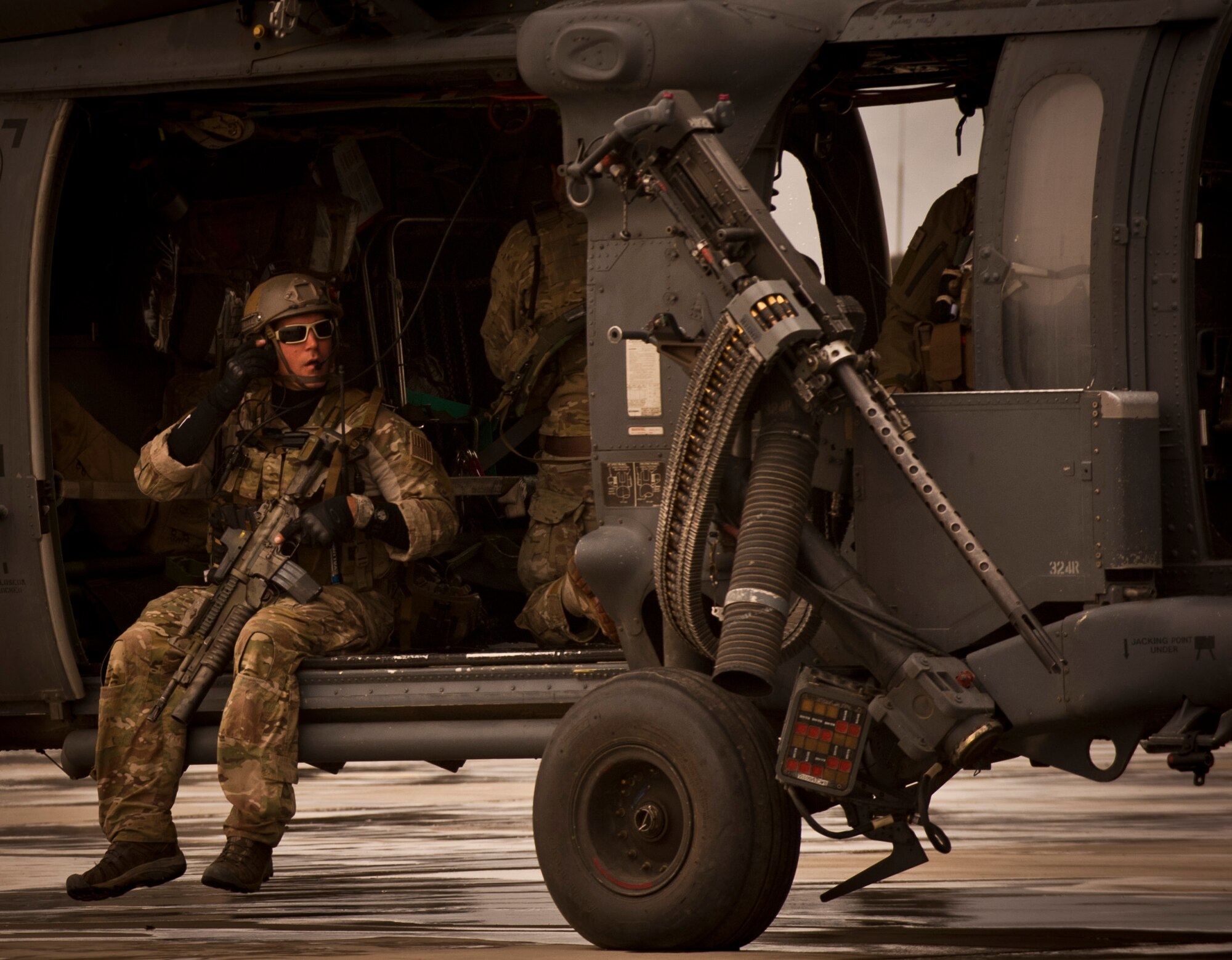 A Pararescueman assigned to the 83rd Expeditionary Rescue Squadron awaits dust-off aboard a U.S. Air Force HH-60G Pave Hawk helicopter at Bagram Airfield, Afghanistan, May 25, 2012. HH-60 crews rely on their maintainers to keep the Pave Hawks in peak condition so they can fly in support of NATO and Afghan forces at a moment’s notice. (U.S. Air Force photo/Capt. Raymond Geoffroy)