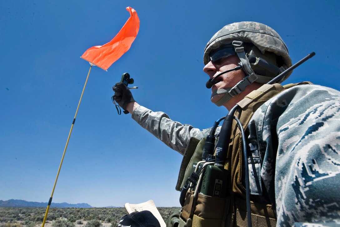 Air Force Tech. Sgt. Kellen Buss uses an anemometer to measure wind speed during a mobility air force exercise at the Nevada Test and Training Range on Nellis Air Force Base, Nev., May 23, 2012.