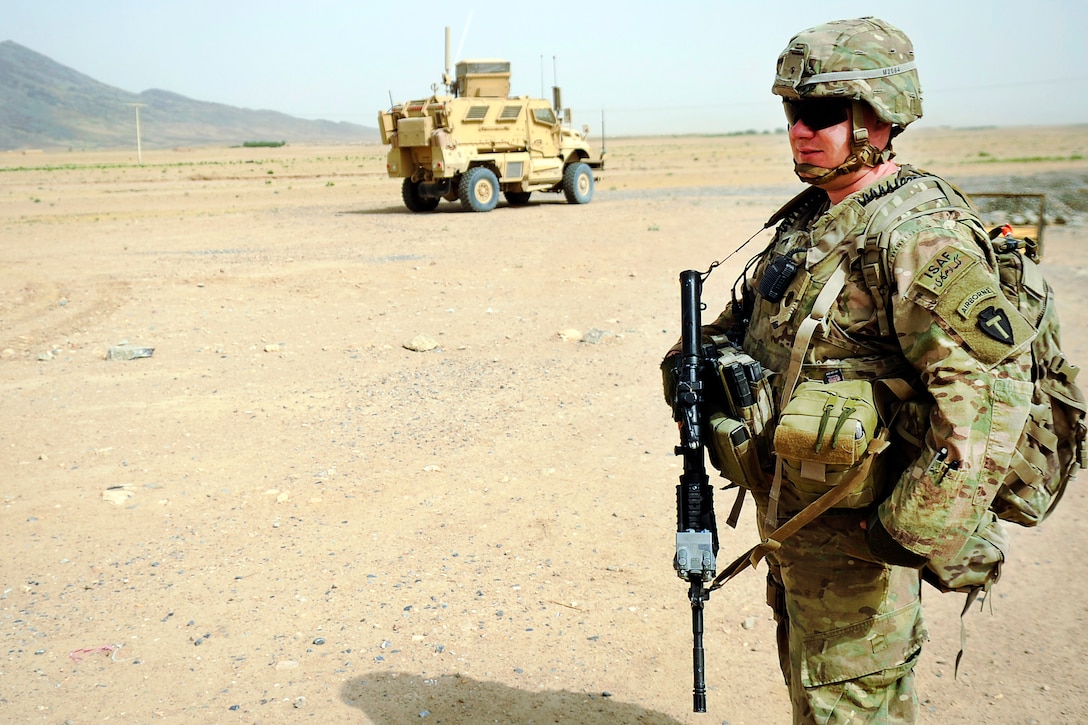 U.S. Army Cpl. Gregory Manning provides security while members of the Kandahar Provincial Reconstruction Team conduct a site survey of the Sanjaray health clinic in Kandahar, Afghanistan, May 24, 2012. Manning is a member of the Kandahar Provincial Reconstruction Team.
