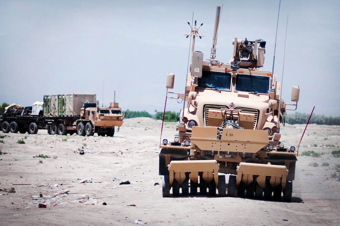 A mine roller leads a combat logistics patrol as they depart Combat Outpost Qara Bagh in Afghanistan's Ghazni province, May 26, 2012.