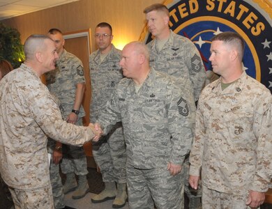 OFFUTT AIR FORCE BASE, Neb. - Sgt. Maj. Bryan Battaglia, Senior Enlisted Advisor to Chairman of the Joint Chiefs of Staff, greets Senior Master Sgt. David Newman, Global Operations Directorate, U.S. Strategic Command, and other senior enlisted personnel prior to taking a group photo during his visit to the command May 29, 2012.  Sergeant Major Battaglia is the second enlisted servicemember to hold the distinction of being the military advisor to the Chairman and the Secretary of Defense on joint and combined total force integration, utilization, health of the force and joint development for enlisted personnel.