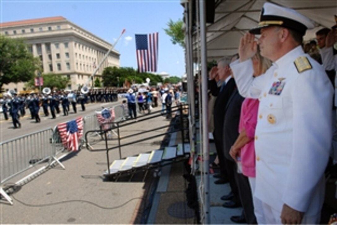 Navy Adm. James A. Winnefeld Jr., vice chairman of the Joint Chiefs of Staff salutes the Air Force marching band at the 2012 National Memorial Day Parade in Washington, D.C.  Adm. Winnefeld and Navy Secretary Ray Mabus, served as official reviewers of the parade.