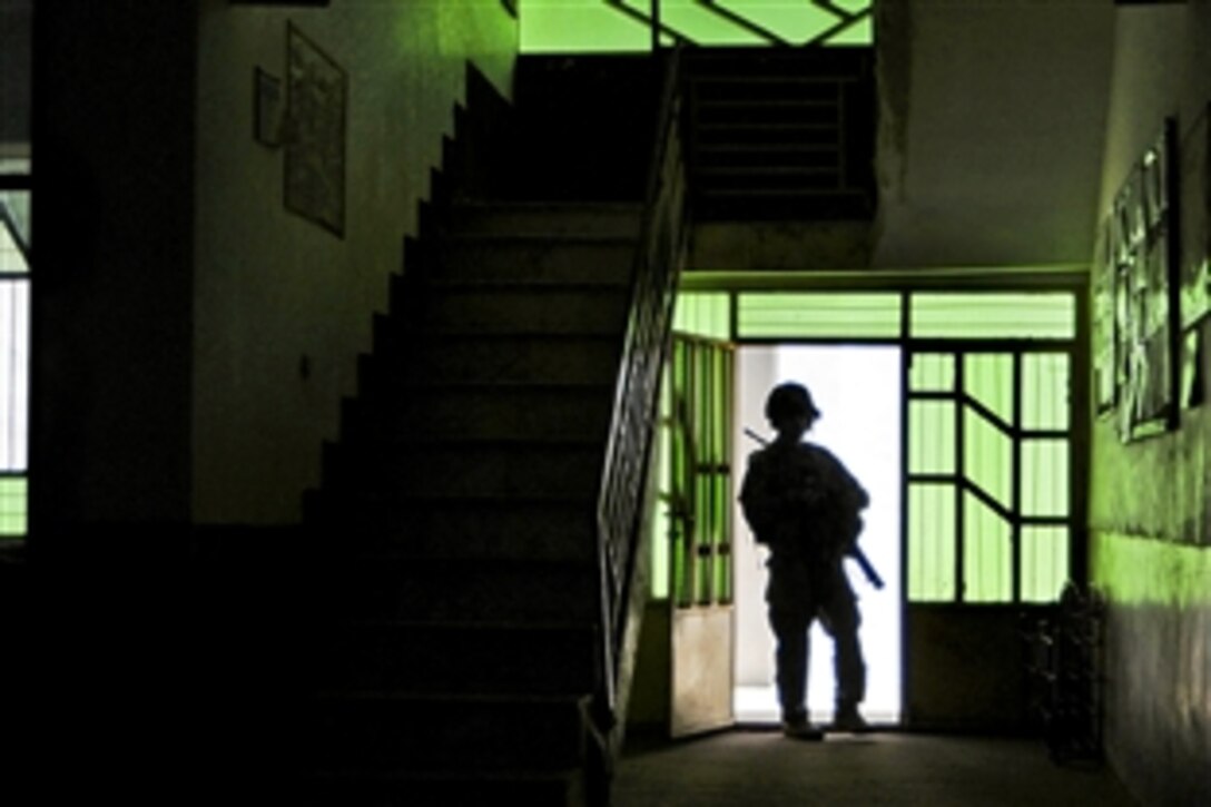 U.S. Army Sgt. 1st Class Michael Nelson provides security during a mission to Farah Midwife School in Farah City in Afghanistan's Farah province, May 26, 2012. Nelson is assigned to Provincial Reconstruction Team Farah, which includes Alaska's National Guard infantrymen, who are responsible for ensuring the safety of the entire team.