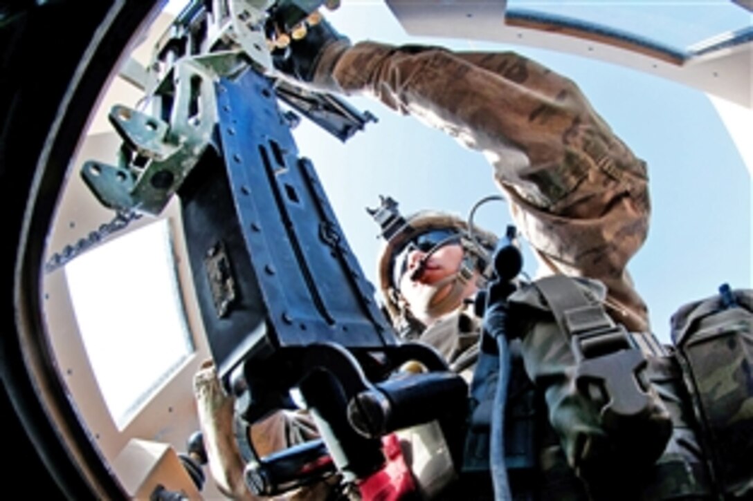 U.S. Army Spc. Michael Sanchez loads an M2 .50-caliber machine gun before his gun truck departs Forward Operating Base Arian to go out on a combat logistics patrol to resupply a combat outpost in Afghanistan's Ghazni province, May 26, 2012. Sanchez, a gunner, is assigned to the 82nd Airborne Division’s Company F, 2nd Battalion, 504th Parachute Infantry Regiment, 1st Brigade Combat Team. 