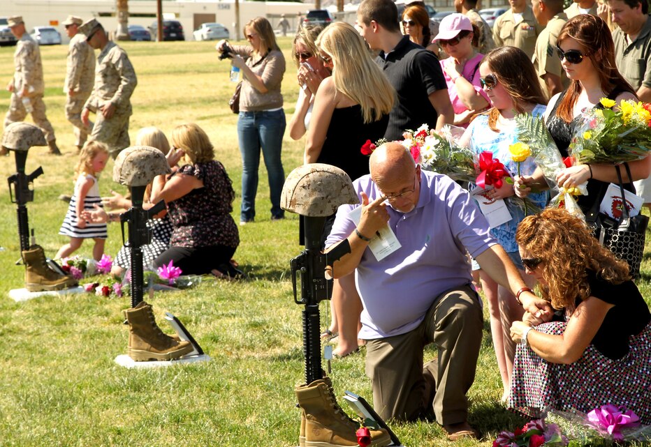 The Barfield family remembers Lance Cpl. Jason Barfield at 3rd Combat Engineers Battalion’s Remembrance Ceremony at Lance Cpl. Torrey L. Gray Field May 30, 2012. Barfield was one of four Marines honored at the ceremony. (Official USMC photo by Lance Cpl. D. J. Wu)