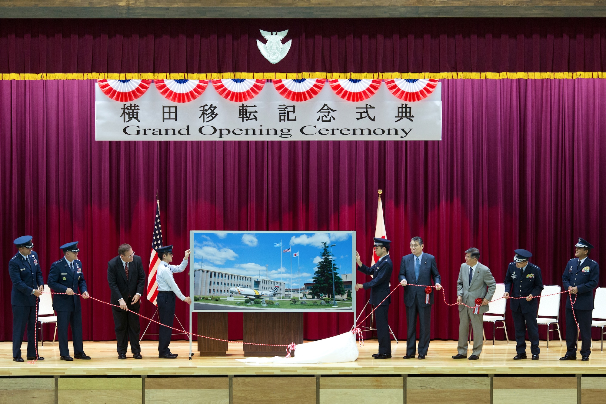 YOKOTA AIR BASE, Japan -- Senior Japanese and U.S. guests unveil a picture honoring the Japan-U.S. Alliance during the Japan Air Self-Defense Force Air Defense Command Headquarters grand opening ceremony at Yokota Air Base, Japan, May 30, 2012. The ADC headquarters was relocated from Fuchu Air Base as part of the 2006 Realignment Roadmap, a bilateral initiative to enhance the U.S.-Japan Security Alliance and address force realignments in the Pacific. (U.S. Air Force photo by Osakabe Yasuo)