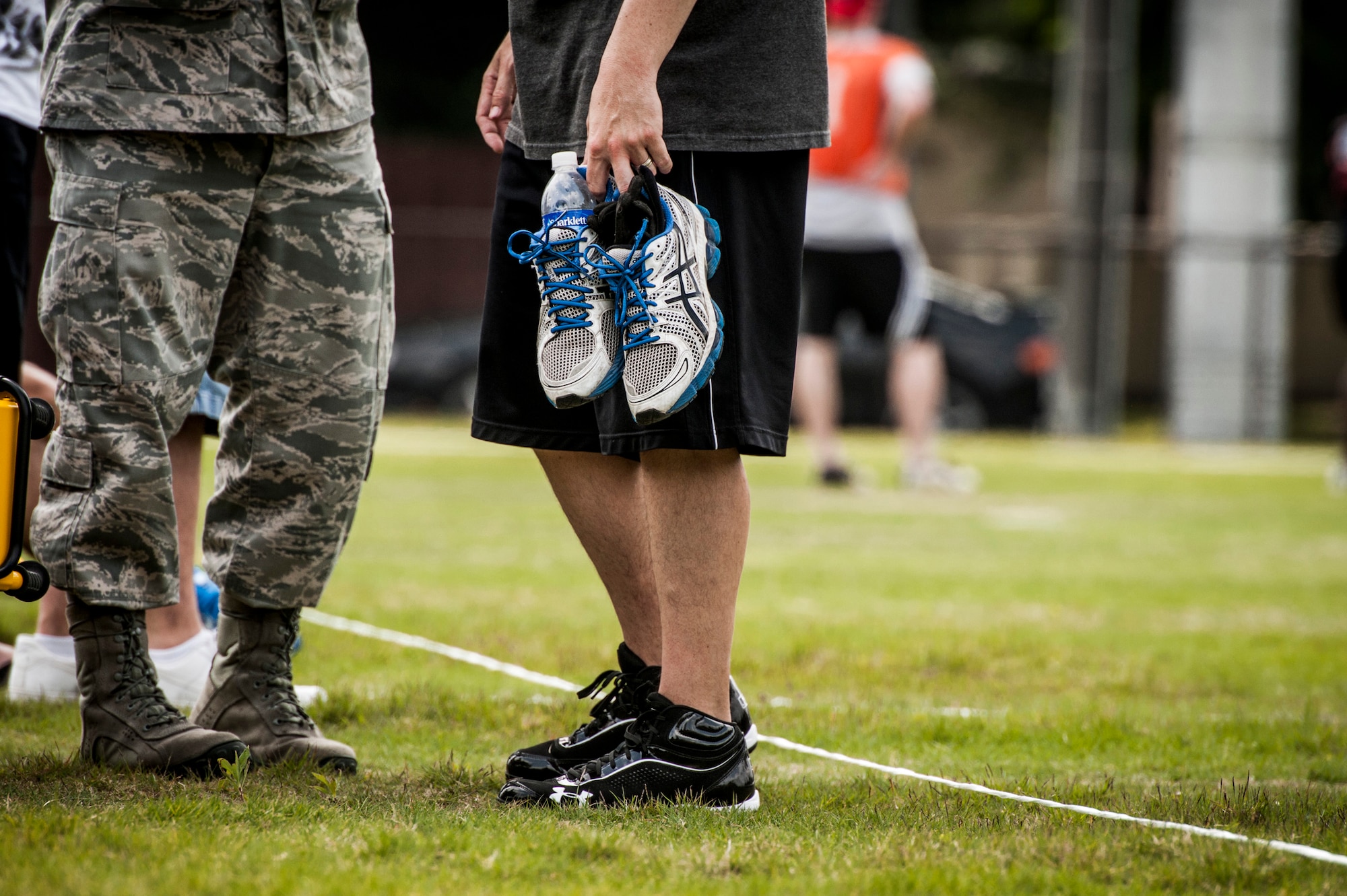 YOKOTA AIR BASE, Japan -- An Airman holds a pair of running shoes for his injured wingman during Airmen Appreciation Day at Yokota Air Base, Japan, May 29, 2012. (U.S. Air Force photo by Staff Sgt. Samuel Morse)