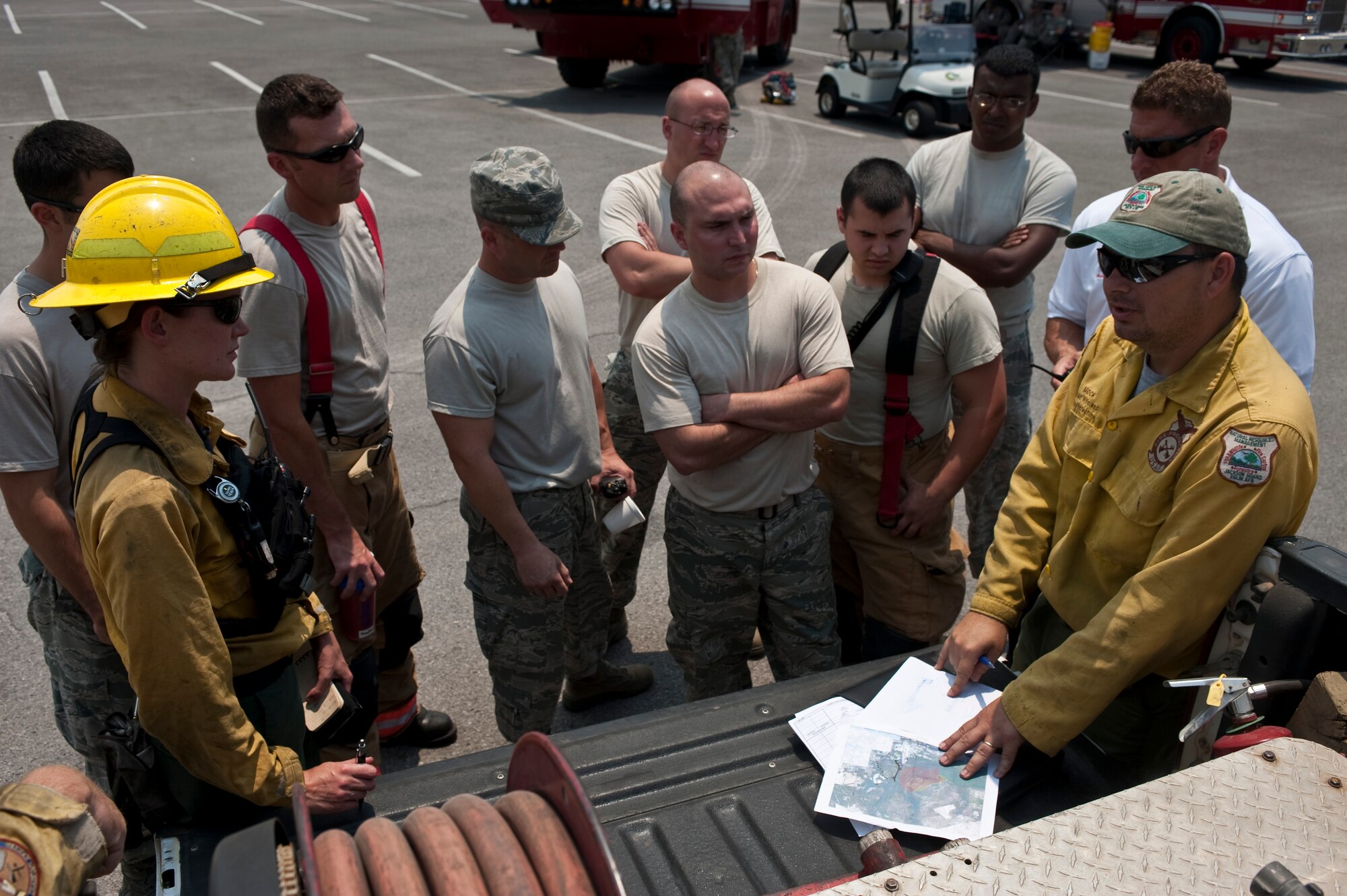 1st Special Operations Civil Engineer Squadron fire department and Jackson Guard personnel prepare to extinguish a fire north of Gator Lakes golf course, Hurlburt Field, Fla., May 30, 2012. The fire started as a result of a previously extinguished prescribed burn that reignited due to extreme weather conditions. (U.S. Air Force Photo/Airman 1st Class Hayden K. Hyatt)
