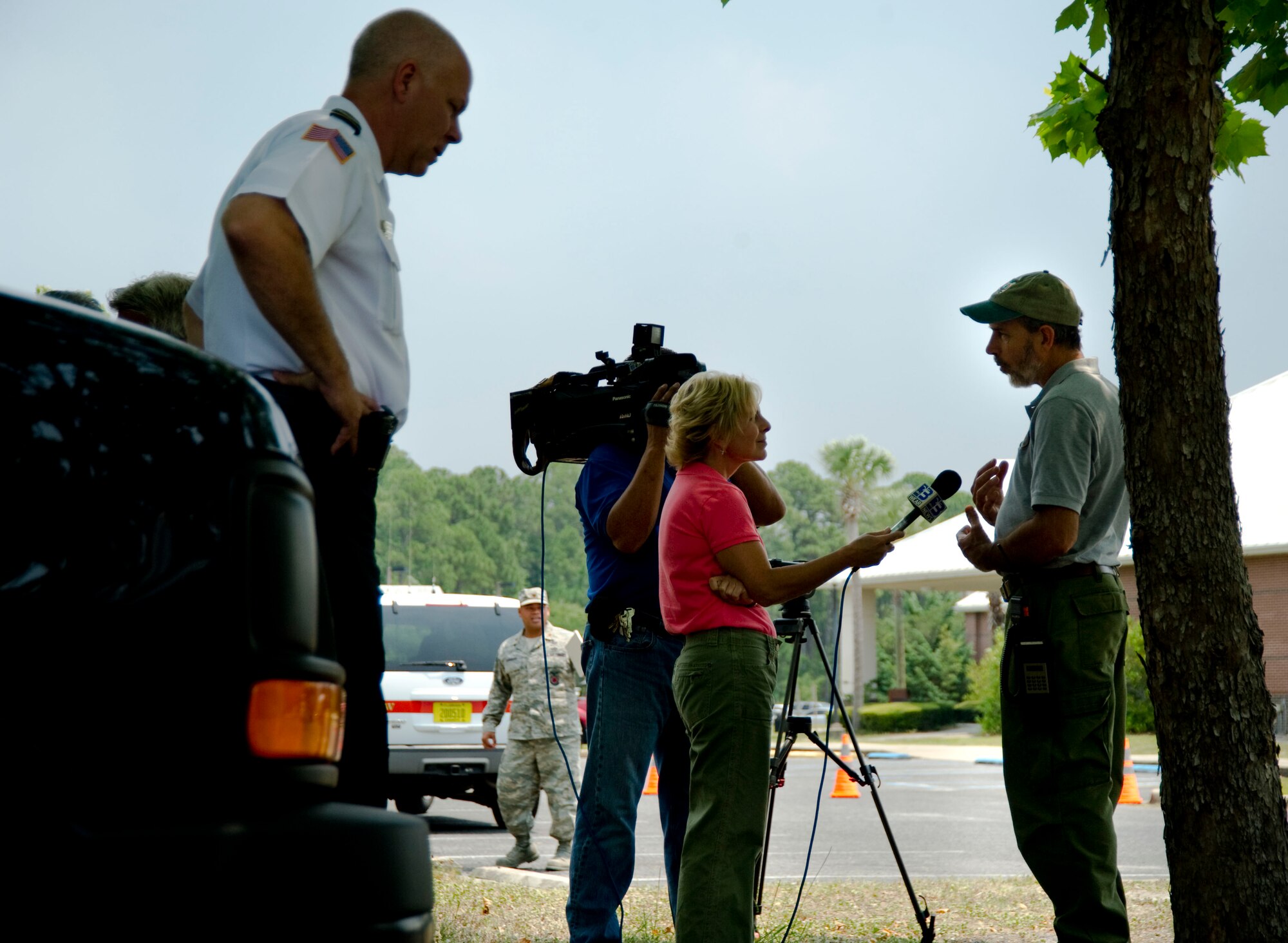 James Furman, Wild Land Firefighter program manager at 96th Civil Engineer Squadron for Eglin Air Force Base, speaks to Laura Hussey for WEAR Channel 3 News at Northwest Florida State College at Fort Walton Beach, Fla., May 30, 2012.  Furman explained the cause of the fire was due to unexpected weather conditions that occurred during a controlled burn. (U.S. Air Force Photo/ Airman 1st Class Naomi M. Griego/RELEASED)

