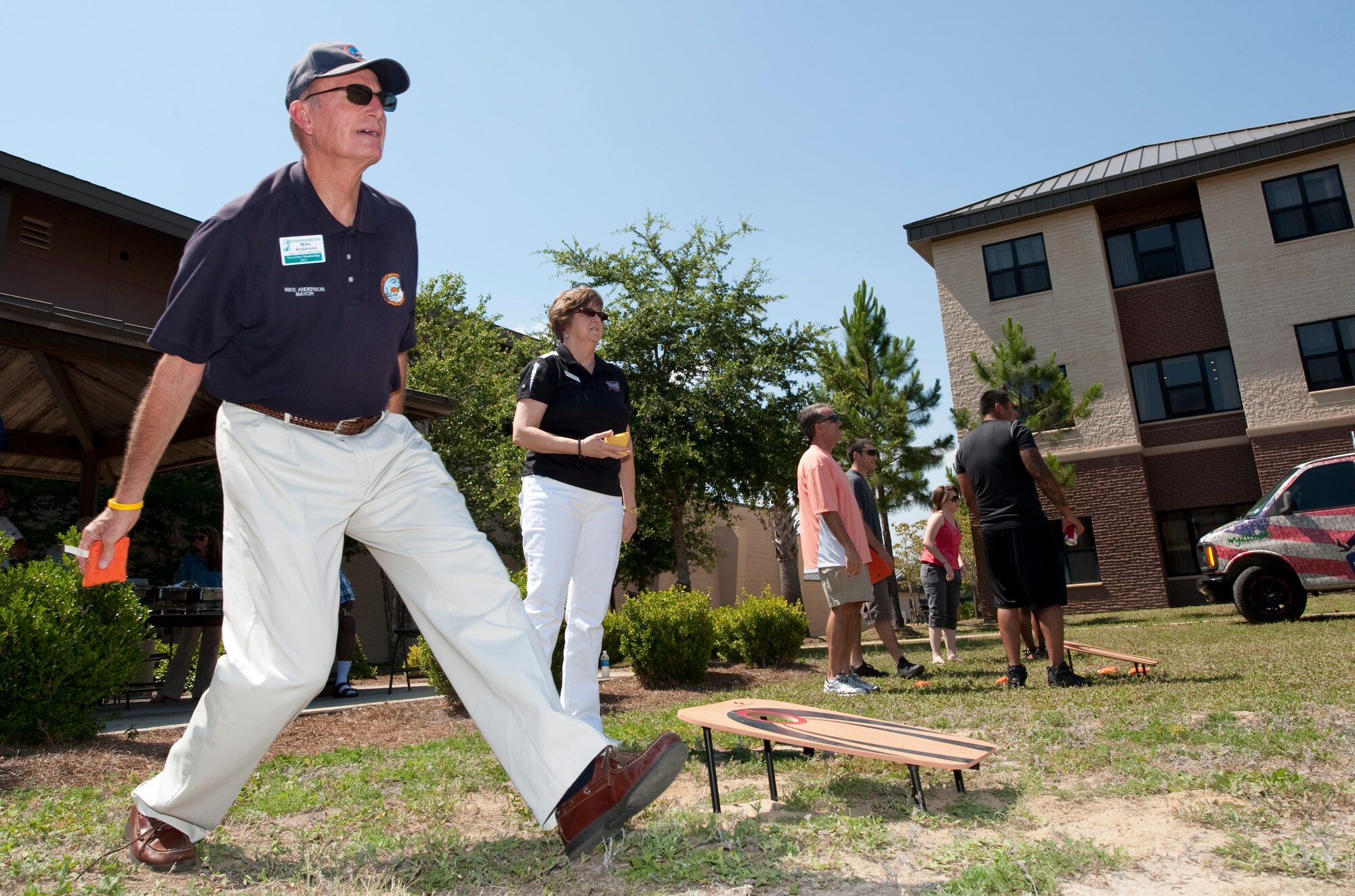 Mike Anderson, mayor of the City of Fort Walton Beach, participates in a game of bean bag toss at the Third Annual Dorm Residents Appreciation Picnic outside the Riptide Dining Facility at Hurlburt Field, Fla., May 24, 2012.  The event also featured bocce ball and various prizes for Airmen. (U.S. Air Force photo by Airman 1st Class Benjamin D. Kim)(Released)