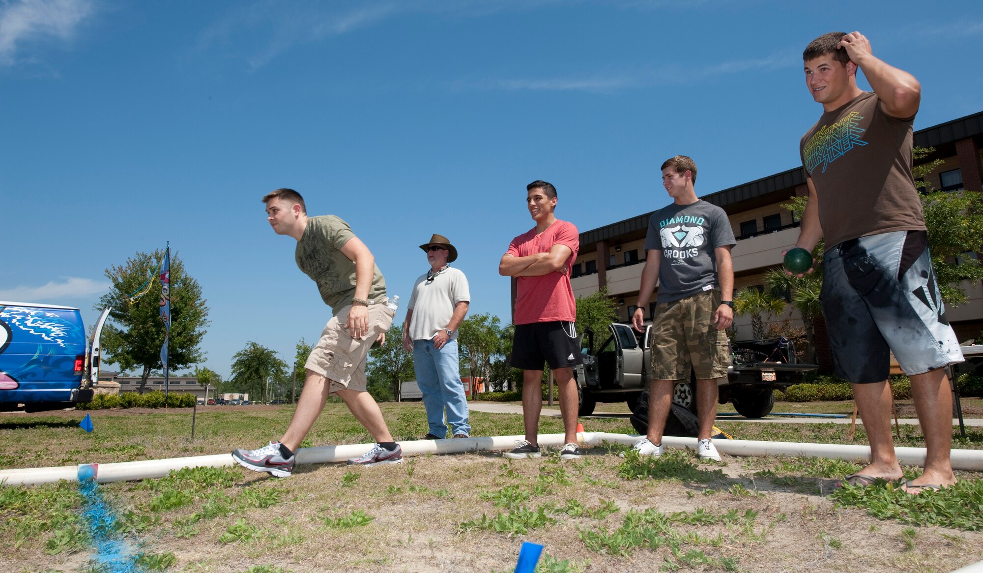 Airmen participate in a game of bocce ball at the Third Annual Dorm Residents Appreciation Picnic outside the Riptide Dining Facility at Hurlburt Field, Fla., May 24, 2012.  Bocce ball is one of several activities that Airmen could participate in for various prizes at the picnic. (U.S. Air Force photo by Airman 1st Class Benjamin D. Kim)(Released)
