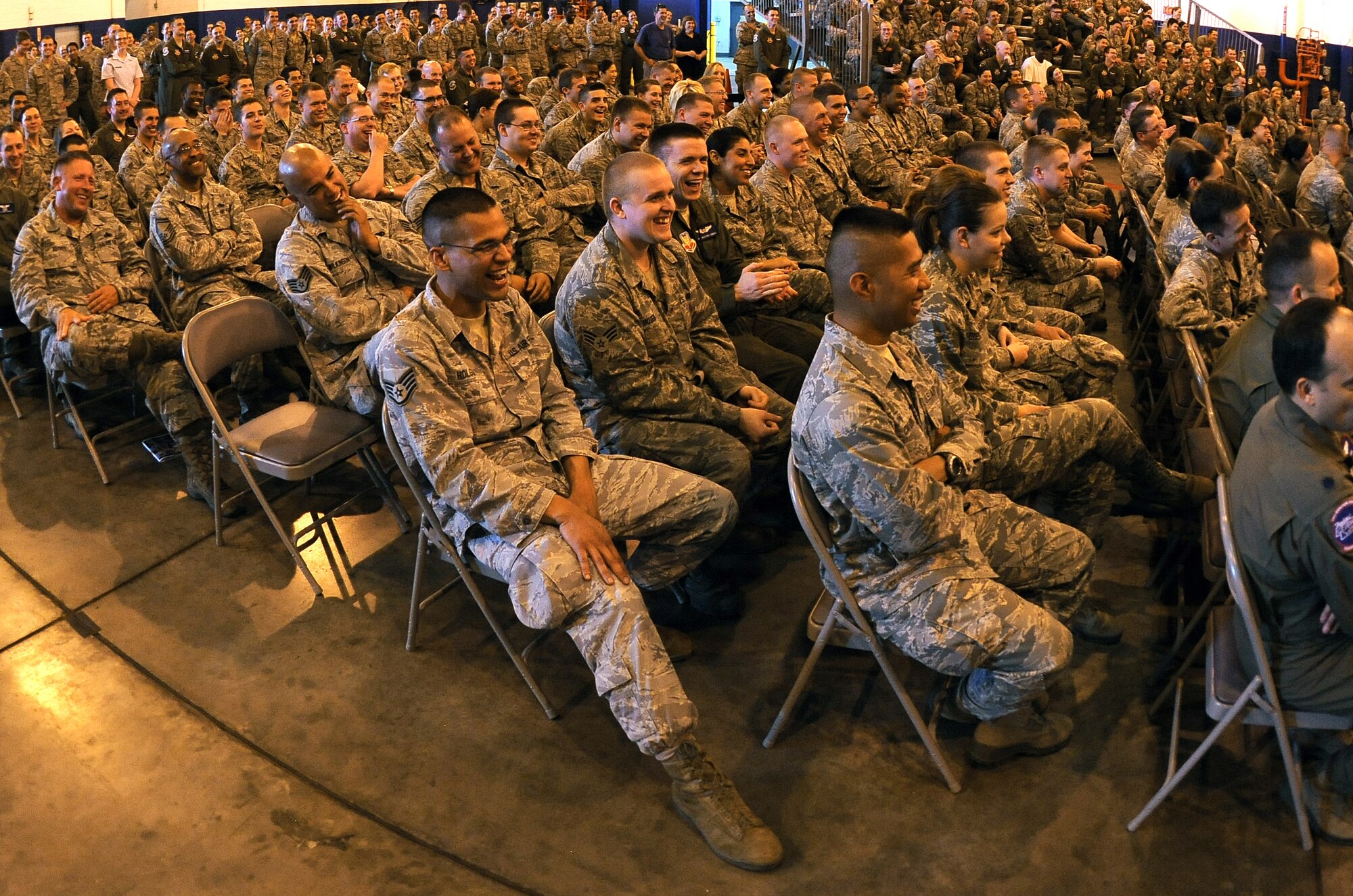 Bobby Henline spoke to a packed hangar of Team Offutt members during a Special Airman's Call May 24 inside the Bennie Davis Maintenance Facility at Offutt Air Force Base, Neb. Henline is a former soldier who while deployed to Iraq had his Humvee hit by an IED. The attack killed four other soldiers in the vehicle, burning more than 35 percent of his body. Henline now travels the country as an inspirational speaker and comedian. (U.S. Air Force photo by Josh Plueger)
