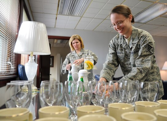 Staff Sgt. Christine Tooth, 92nd Air Refueling Wing protocol specialist, arranges water goblets during a recent visit by Gen. Raymond Johns, Jr., Air Mobility Command commander, at Fairchild Air Force Base, Wash., May 20, 2012. If something needs to be done, whether it’s picking up trash, pitching luggage or washing vehicles and someone else hasn't done their job, then the wing’s protocol office is there getting the mission done. (U.S. Air Force photo/Airman 1st Class Ryan Zeski)