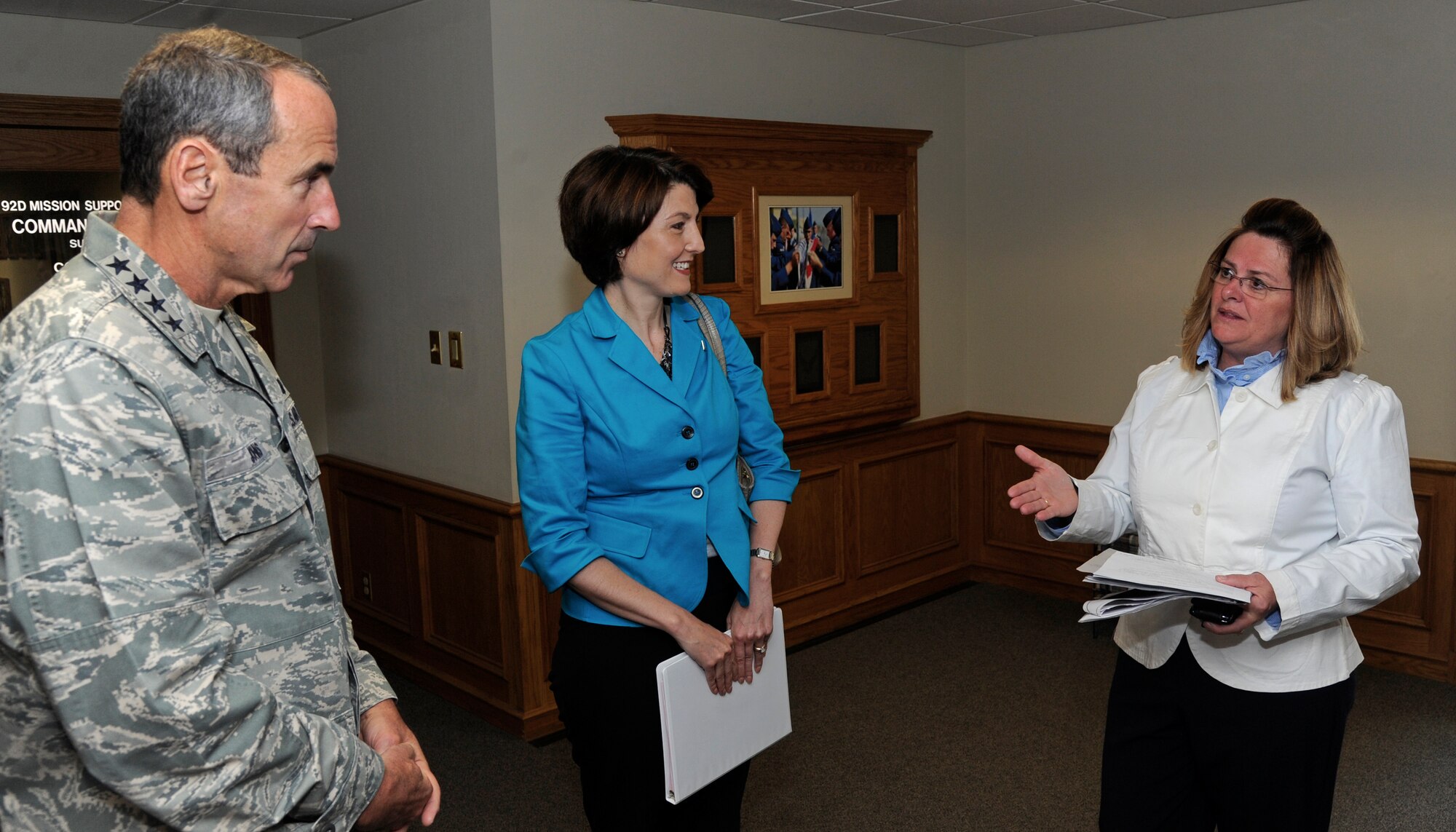 Gen. Raymond Johns, Jr., Air Mobility Command commander, along with Cathy McMorris Rogers, U.S. Representative for the 5th District of Washington, discuss protocol matters with Bo Smith-Tallan, 92nd Air Refueling Wing protocol chief, during a recent visit to Fairchild Air Force Base, Wash., May 19, 2012. If something needs to be done, whether it’s picking up trash, pitching luggage or washing vehicles and someone else hasn't done their job, then the wing’s protocol office is there getting the mission done. (U.S. Air Force photo by Airman 1st Class Ryan Zeski/Released)