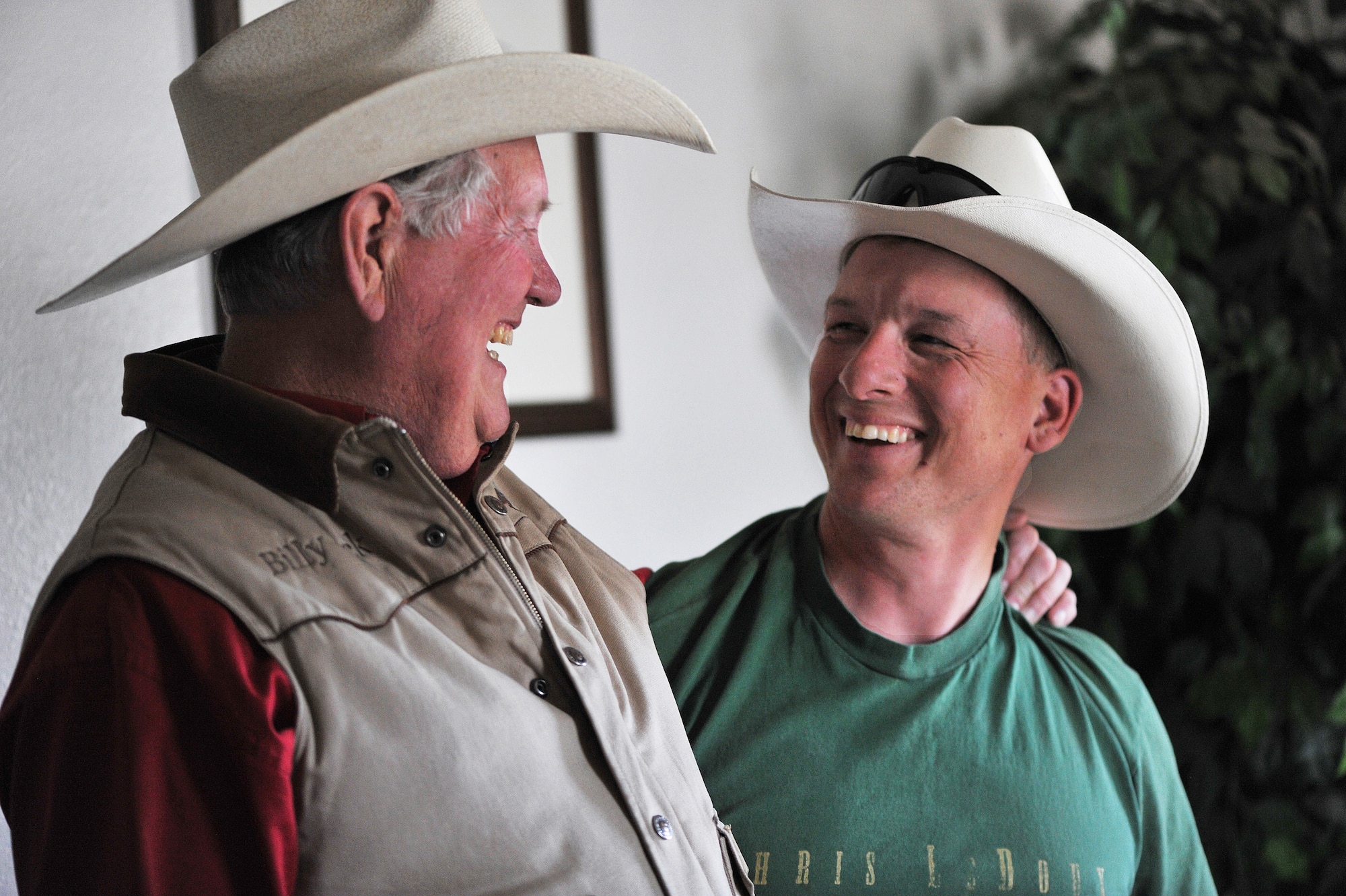 U.S. Army Sgt. Dale Chick (right) shares a light moment with Billy Jack Barrett at the equestrian center April 27, 2012, at the U.S. Air Force Academy in Colorado Springs, Colo. Chick said that volunteering at the stables and working with horses help them find inner peace and comfort after being deployed in Iraq and Afghanistan. Barrett is the director of the center. (U.S. Air Force photo/Val Gempis)
