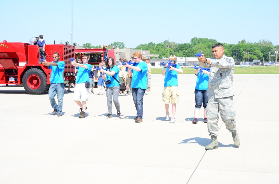 WRIGHT-PATTERSON AIR FORCE BASE, Ohio - Staff Sgt. Gustavo Medina, 445th Security Forces Squadron, walks Venturing Crew #898 members from Gahanna, Ohio, through various security forces scenarios during Scouts Day. Venturing Crew members are a co-ed group of 14- to 21-year-olds in an extended Boys of America Scouting program. (U.S. Air Force photo/Staff Sgt. Amanda Duncan)