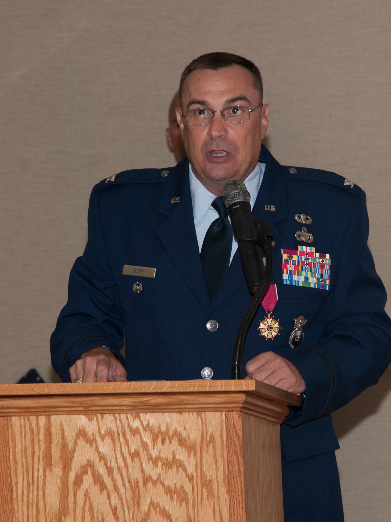 U.S. Air Force Col. Donald Derry, Pacific Air Forces Security Forces Division chief, Joint Base Pearl Harbor-Hickam, Hawaii, speaks about his Air Force career during his retirement ceremony at Moody Air Force Base, Ga., May 29, 2012. Derry gave thanks to everyone who helped him in his career and everyone who attended his retirement ceremony. Derry served as the commander of the 820th SFG, now known as the 820th Base Defense Group, at Moody from April 2008 to June 2010. (U.S. Air Force Photo by Airmen 1st Class Paul Francis/Released) 