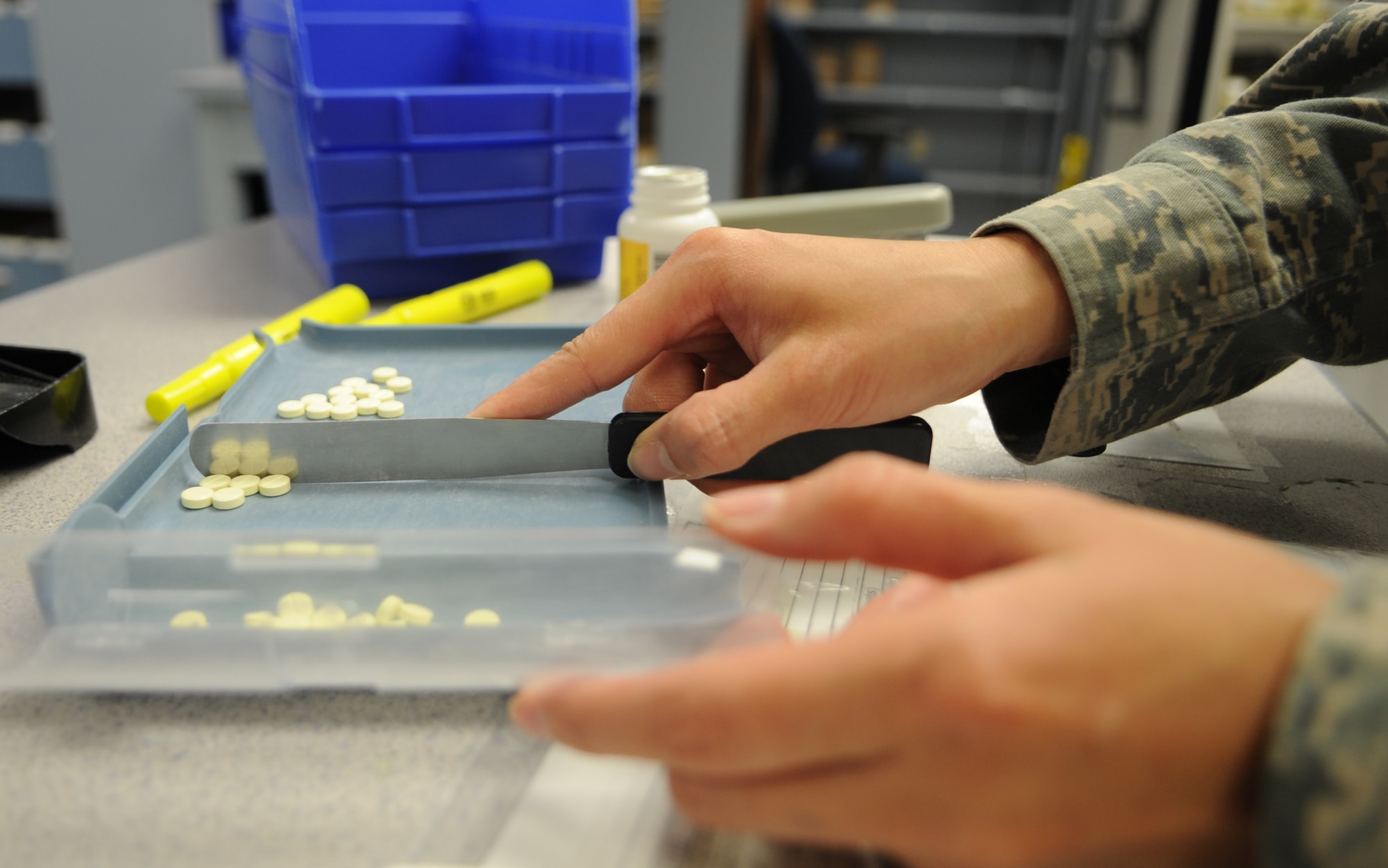 U.S. Air Force Capt. Crystal Cha counts medication for a prescription refill at the pharmacy on Seymour Johnson Air Force Base, N.C., May 30, 2012. Cha counts each tablet prior to filling a bottle to ensure the patient will receive the correct amount as directed by medical providers. Cha, 4th Medical Support Squadron pharmacist, hails from Hickory, N.C. (U.S. Air Force photo/Airman 1st Class Aubrey Robinson/Released)