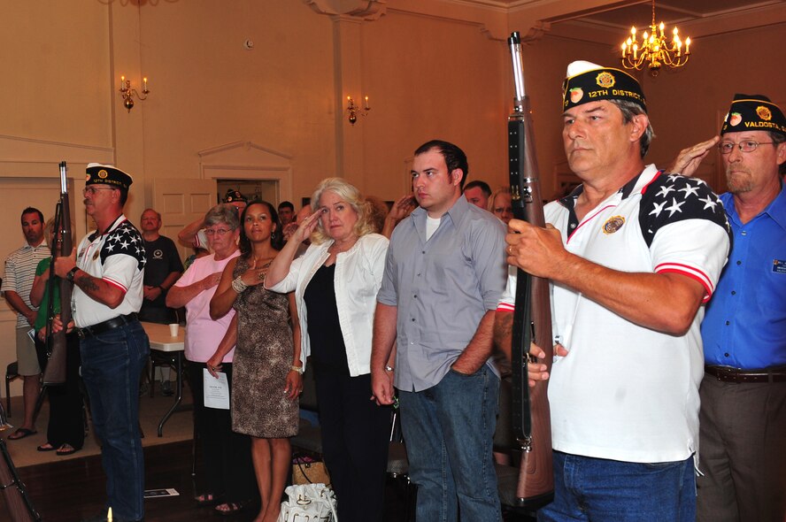 Members of the American Legion Post 13 color guard stand at attention while the posting of the colors during a Memorial Day ceremony in Valdosta, Ga., May 28, 2012. The city of Valdosta holds a Memorial Day ceremony every year to honor active, retired and fallen service members. (U.S. Air Force photo by Staff Sgt. Stephanie Mancha/Released)
