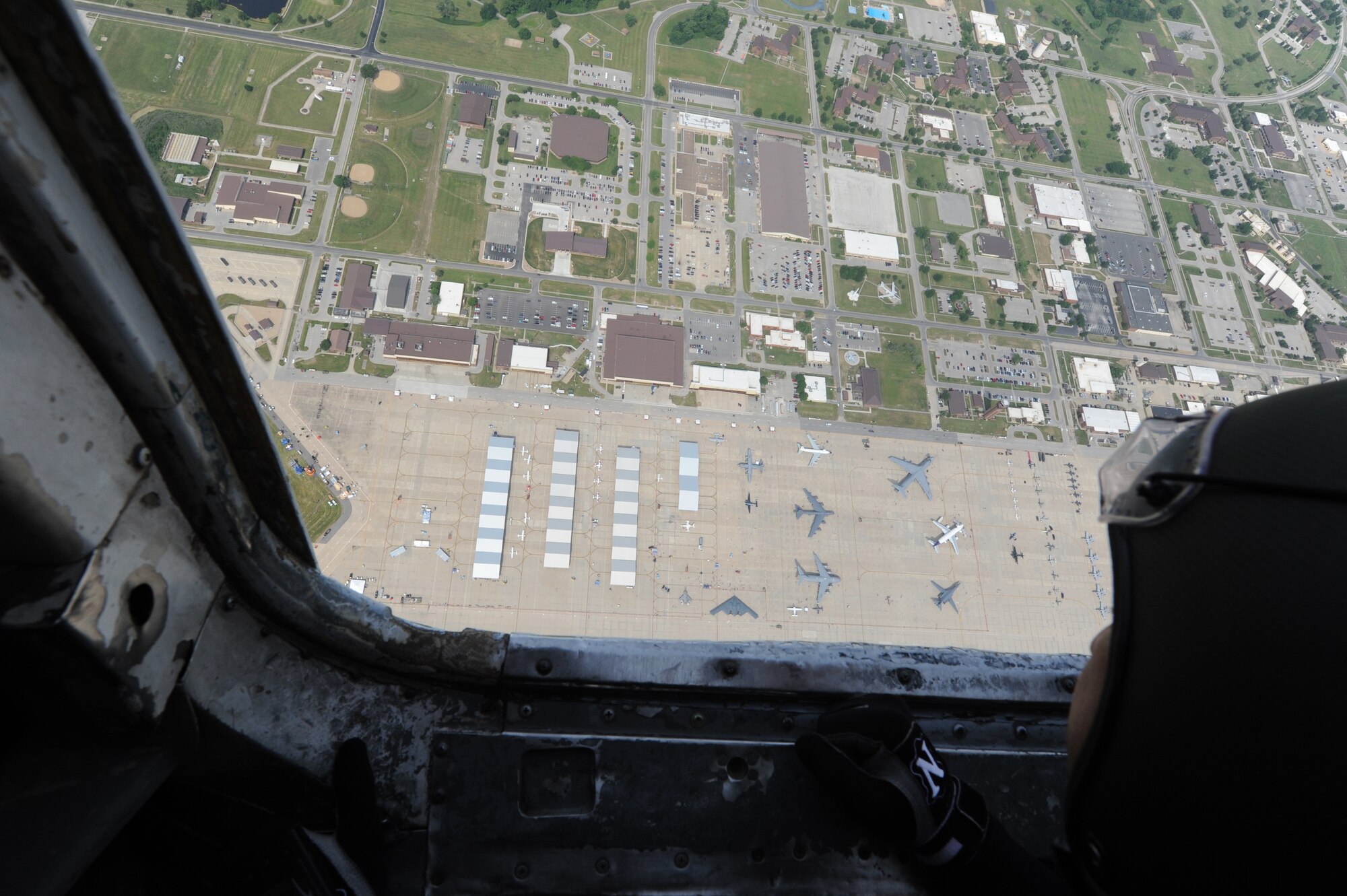 WHITEMAN AIR FORCE BASE, Mo. -- A team member from the U.S. Army Golden Knights Parachute Team looks over Whiteman AFB before their performance at the 2012 Wings Over Whiteman Open House and Air Show May 20, 2012. Whiteman AFB hosted a two-day open house and air show here May 19 and 20, 2012, which included demonstrations of military capabilities and static aircraft displays. (U.S. Air Force photo/Airman 1st Class Bryan Crane)(Released)