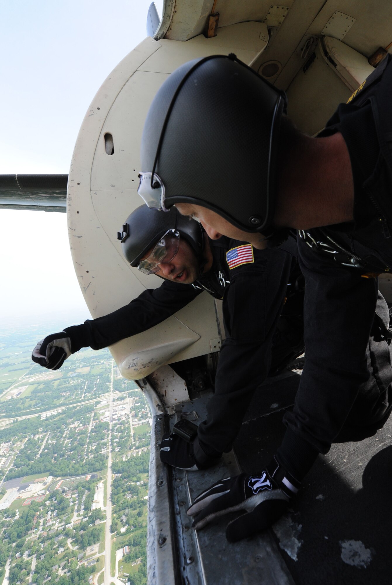 WHITEMAN AIR FORCE BASE, Mo. -- Members of the U.S. Army Parachute Team, the Golden Knights, prepare for their jump at the 2012 Wings Over Whiteman Open House and Air Show May 20, 2012. Whiteman AFB hosted a two-day open house and air show here May 19 and 20, 2012, which included demonstrations of military capabilities and static aircraft displays. (U.S. Air Force photo/Airman 1st Class Bryan Crane)(Released)