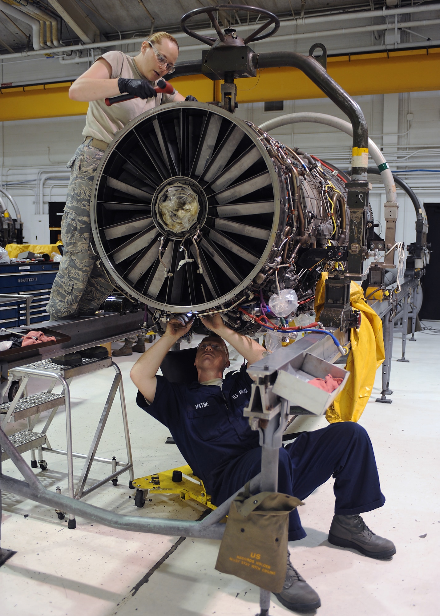 U.S. Air Force Staff Sgt. Joseph Mathe and Airman 1st Class Vanessa Redman perform routine maintenance on an F-15E Strike Eagle engine on Seymour Johnson Air Force Base, N.C., May 29, 2012. Mathe, 4th Component Maintenance Squadron jet engine mechanic, is from Kathleen, Ga. Redman, 4th CMS jet engine mechanic, is a native of Anacoco, La. (U.S. Air Force photo/Airman 1st Class John Nieves Camacho/Released)