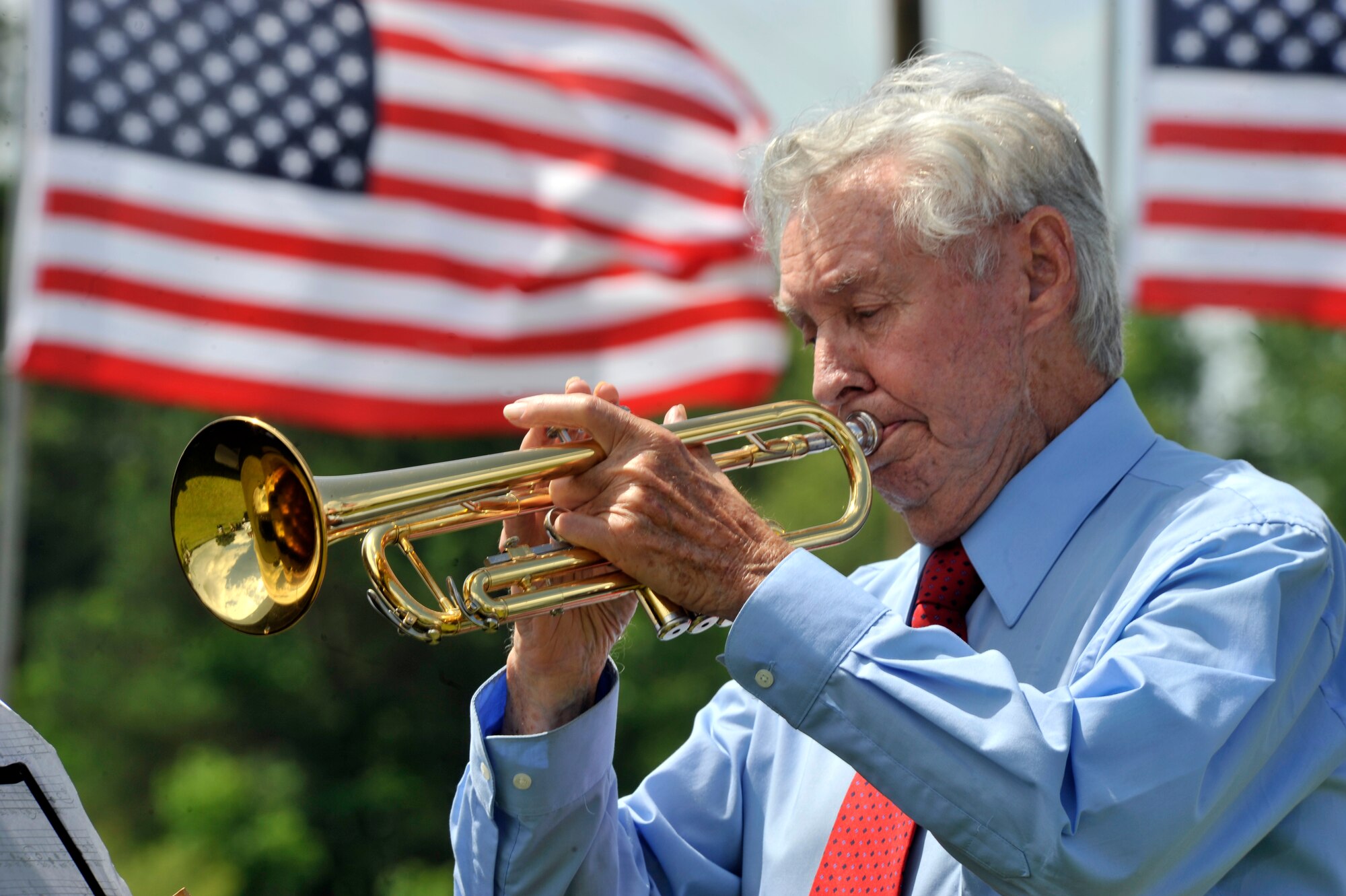Paul Jennings plays the trumpet to 'God Bless America,' during the Memorial Day Ceremony at General George Mabry's Memorial in Sumter, S.C., May 28, 2012. 'God Bless America' is an American patriotic song that is used in a form of prayer for the blessing and peace of the nation.  (U.S. Air Force photo by Senior Airmen Tabatha McCarthy/released)