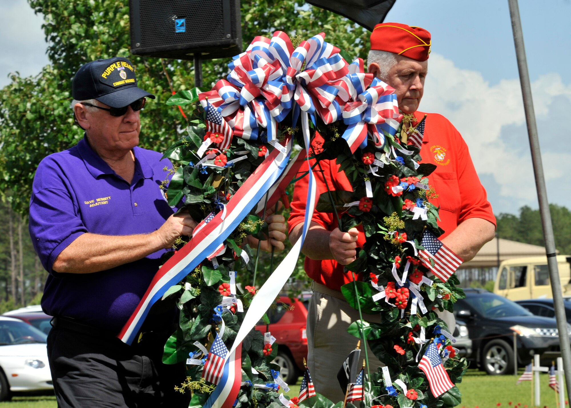 Dave Nesbitt, adjutant with the Purple Heart Association, and Joe Smith, with the Marine Corps League, perform the Memorial Wreath Ceremony during the Memorial Day Ceremony at General George Mabry's Memorial in Sumter, S.C., May 28, 2012. The Memorial Day Ceremony was held in remembrance of all the lives lost by men and women who served in the United States Armed Forces. (U.S. Air Force photo by Senior Airmen Tabatha McCarthy/released)