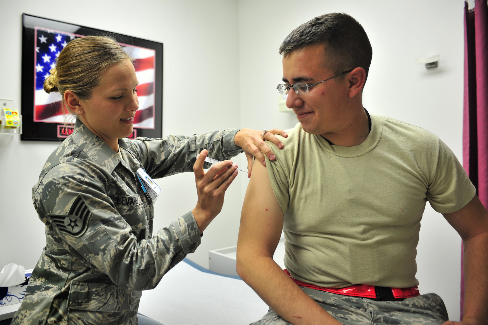 U.S. Air Force Staff Sgt. Dena Levari, 27th Special Operations Medical Operations Squadron NCOIC of immunizations, prepares to vaccinate 2nd Lt. Jose Valadez, 27th Special Operations Aircraft Maintenance Squadron, with Gardasil in the clinic at Cannon Air Force Base, N.M., May 29, 2012. The Gardasil vaccine protects against four types of the Human Papillomavirus and has recently been cleared for use on males. (U.S. Air Force photo by Airman 1st Class Alexxis Pons Abascal)  