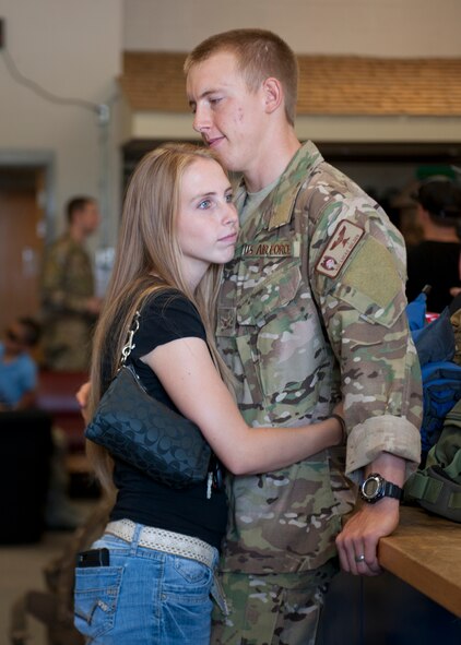 U.S. Air Force Airman 1st Class Lucas Golden, 38th Rescue Squadron, spends time with a loved one before leaving for his first deployment to Afghanistan at Moody Air Force Base, Ga., May 24, 2012. Airmen with the 38th RQS and other rescue units will be accompanied by National Geographic, who are doing a six episode series on the PJs. (U.S. Air Force photo by Senior Airman Eileen Meier/Released)