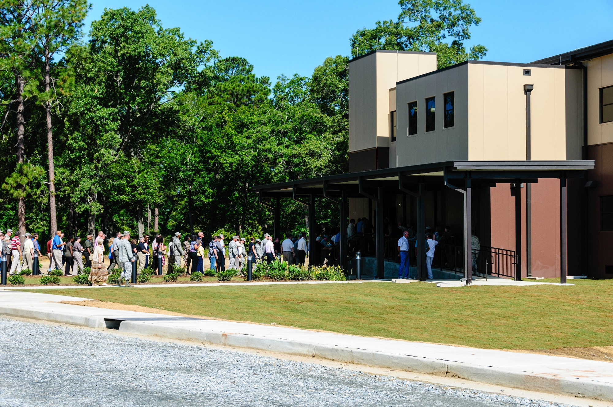 Air Force Reserve Command members enter the new AFRC Modular Facility after a ribbon-cutting ceremony May 30, 2012, on Robins Air Force Base, Ga. The new facility will provide office space for A1 Manpower and Personnel, A4 Logistics, A7 Installations and Mission Support, and the Readiness Management Group. (U.S. Air Force photo by Alexy Saltekoff)
