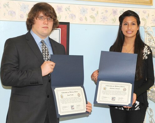 KIRTLAND AFB, N.M. -- Jason Durkis and Christine Freeman each received a $1,500 scholarship from the Kirtland Air Force Base Commissary and Fisher House Foundation May 17 for academic achievement, and school and community activities. Durkis is a junior at Tulane University, New Orleans, La., pursuing a degree in premedicine and Freeman will attend the University of New Mexico in the fall to pursue a degree in nursing. (Photo by Dennis Carlson) 
