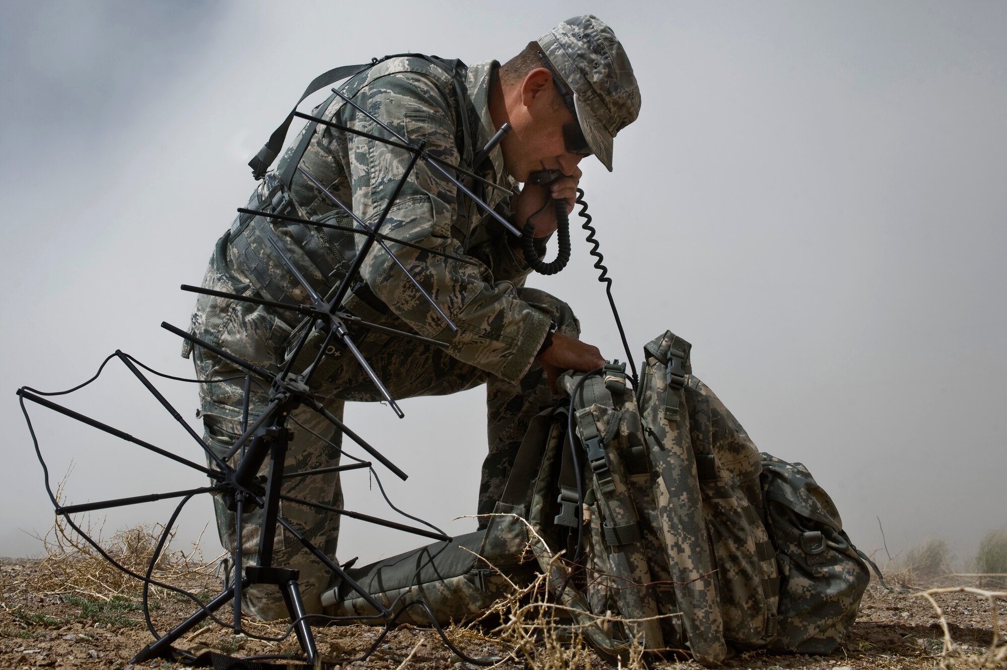 U.S. Air Force Lt.Col. Matthew Lengal, 18th Air Support Operations Group Air Liasion Officer from Fort Bragg N.C., communicates with C-17 Globemaster III as they land during a Mobility Air Force Exercise May 23, 2012, on the Nevada Test and Training Range. Airman and Soldiers from more than five units took part of the ground support portion of MAFEX. (U.S. Air Force photo by Airman 1st Class Daniel Hughes) 



