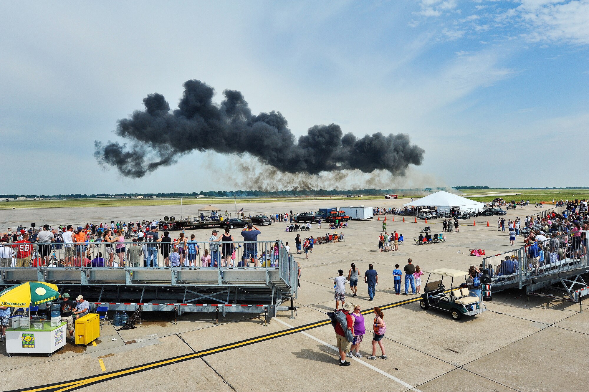 WHITEMAN AIR FORCE BASE, Mo. -- Spectators watch as a cloud of smoke fills the sky from a B-2 Spirit ‘Wall of Flame’ demonstration during the 2012 Wings Over Whiteman Open House and Air Show May 19, 2012. The two-day air show attracted approximately 40,000 people from all over the U.S. (U.S. Air Force photo/Senior Airman Nick Wilson) (Released)