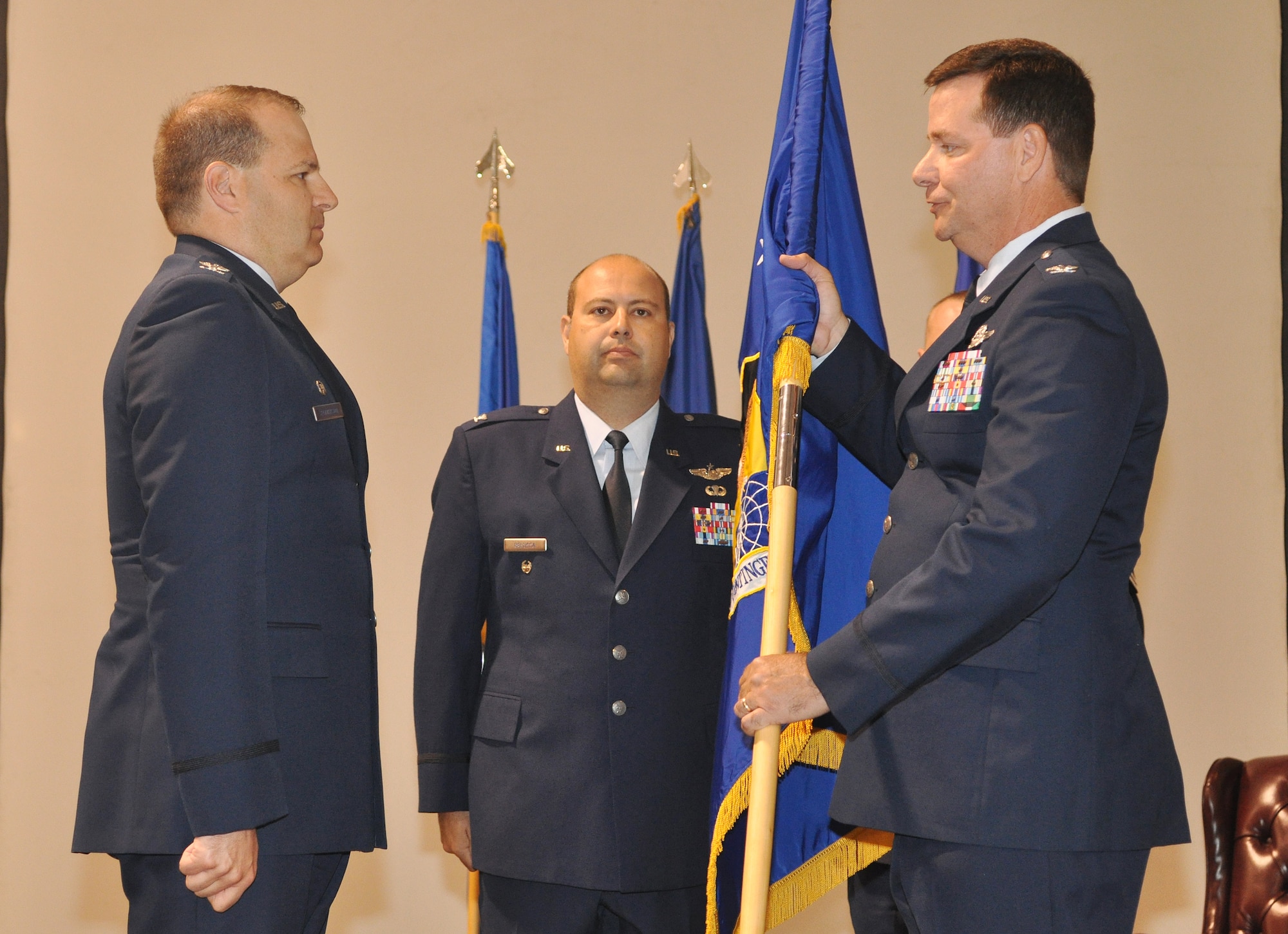 Colonel Gary Gottschall, former 615th Contingency Response Wing commander, prepares to transfer command of his units to Colonel Chris Patterson, 621 CRW, during the inactivation ceremony 615 CRW, May 29, 2012, at Travis Air Force Base, Calif. The 615 CRW ceased its operations as a sister wing, ending seven years of mobility excellence. The inactivation ceremony also included the transfer of command of the two contingency response groups and one contingency operations group to the 621st Contingency Response Wing, headquartered at Joint Base McGuire-Dix-Lakehurst, N.J. (U.S. Air Force Photo / Master Sgt. Stan Parker)