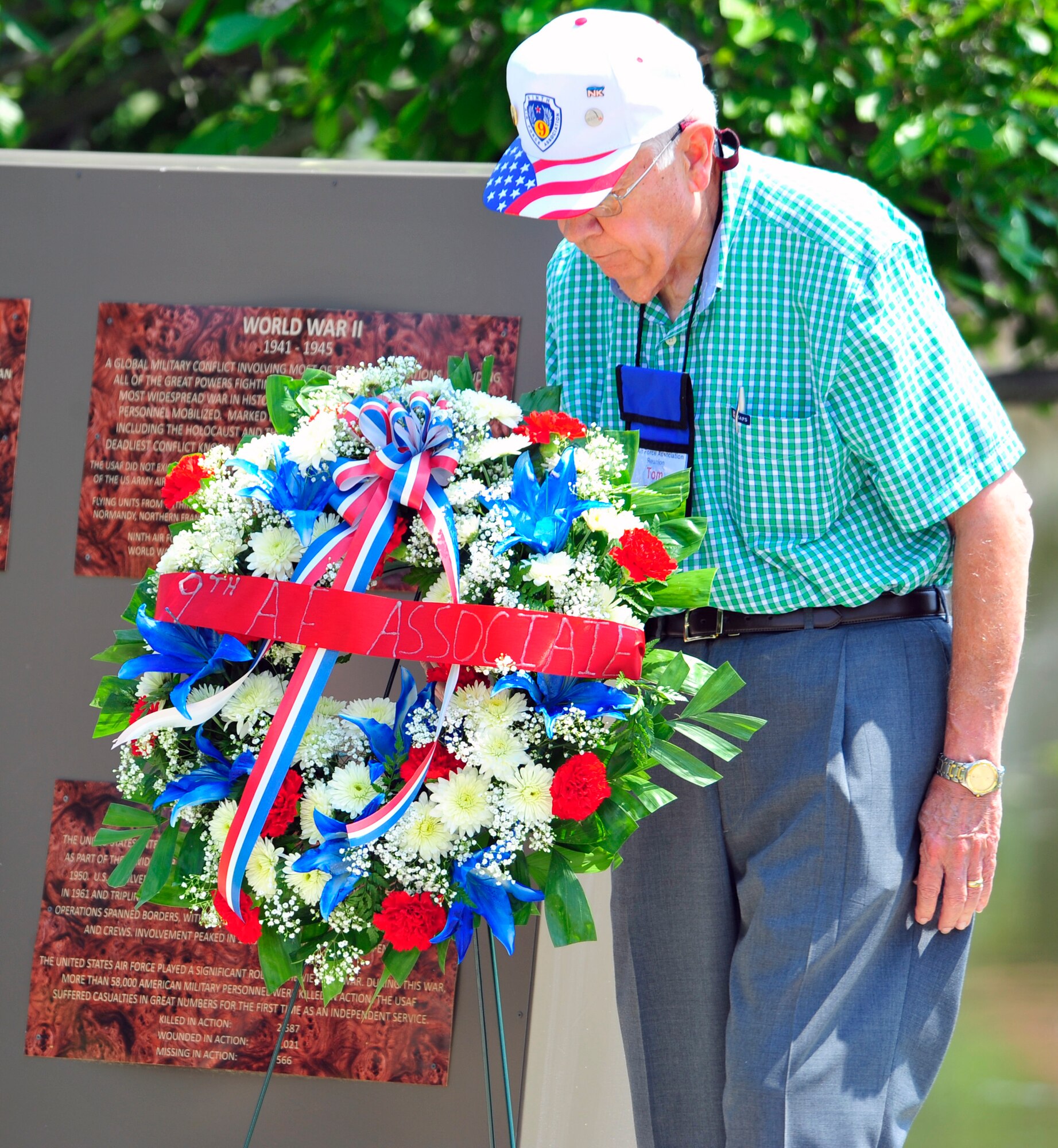 Tom Olsen, 9th Air Force Association member, places a wreath by the Fallen Airman Memorial at Memorial Lake, Shaw Air Force Base, S.C., May 24, 2012. The 9th AFA began on July 20, 1990 when representatives from World War II combat units gathered in St. Louis, Mo. to preserve and publicize its’ history. (U.S. Air Force photo by Senior Airman Daniel Phelps/Released)