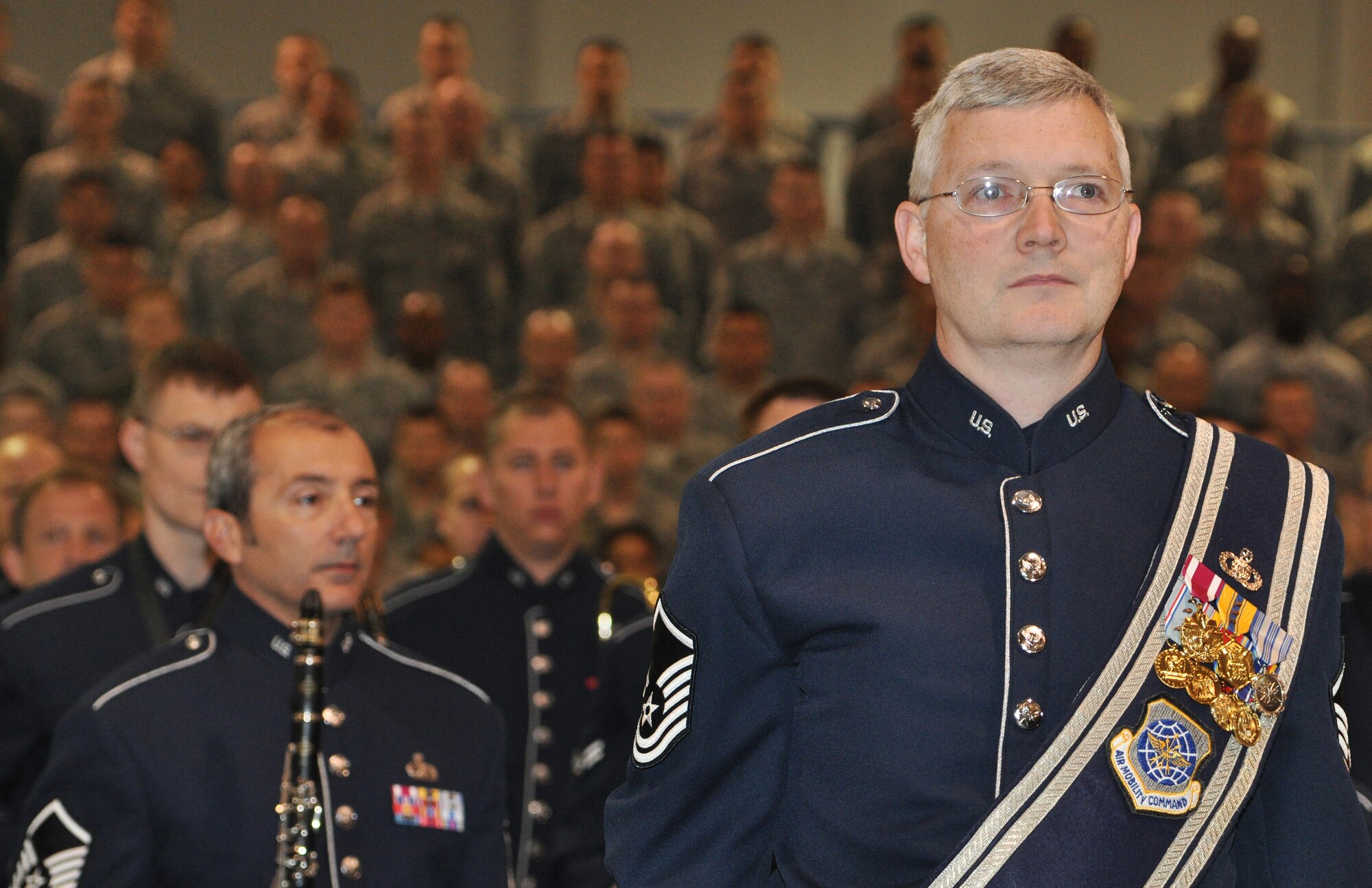 Master Sgt. Henry Dodd Martin, U.S. Air Force Band of the Golden West drum major, pauses for the posting of the colors during the inactivation of the 615th Contingency Response Wing, May 29, 2012, at Travis Air Force Base, Calif. The 615 CRW ceased its operations as a sister wing, ending seven years of mobility excellence. The inactivation ceremony included the transfer of command of the two contingency response groups and one contingency operations group to the 621st Contingency Response Wing, headquartered at Joint Base McGuire-Dix-Lakehurst, N.J. (U.S. Air Force Photo / Master Sgt. Stan Parker)