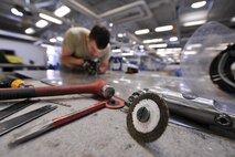 MINOT AIR FORCE BASE, N.D.-- Senior Airman Larry Horstman, 5th Maintenance Squadron aircraft structural maintenance journeyman, fabricates aircraft parts here May 22. The 5th MXS supports the 5th Bomb Wing by providing equipment maintenance on its B-52H Stratofortresses. (U.S. Air Force photo/Senior Airman Brittany Y. Auld)
